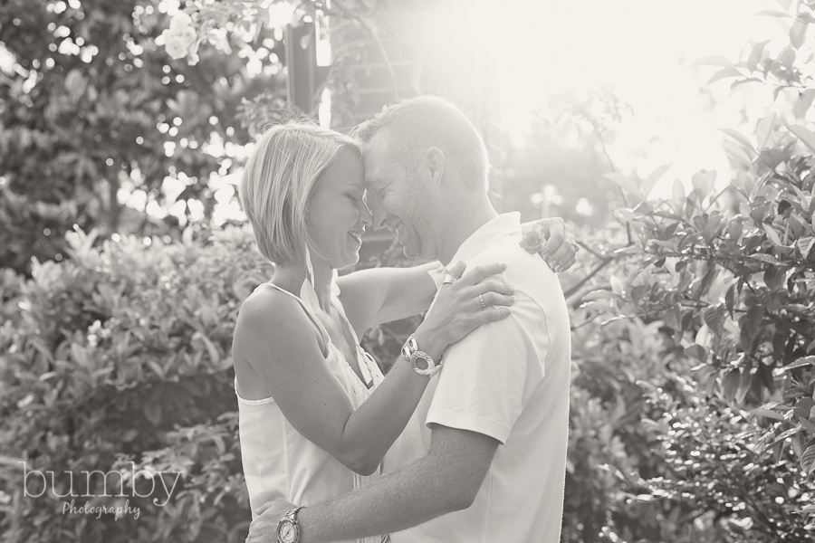 couple nose to nose in sun, engagement session