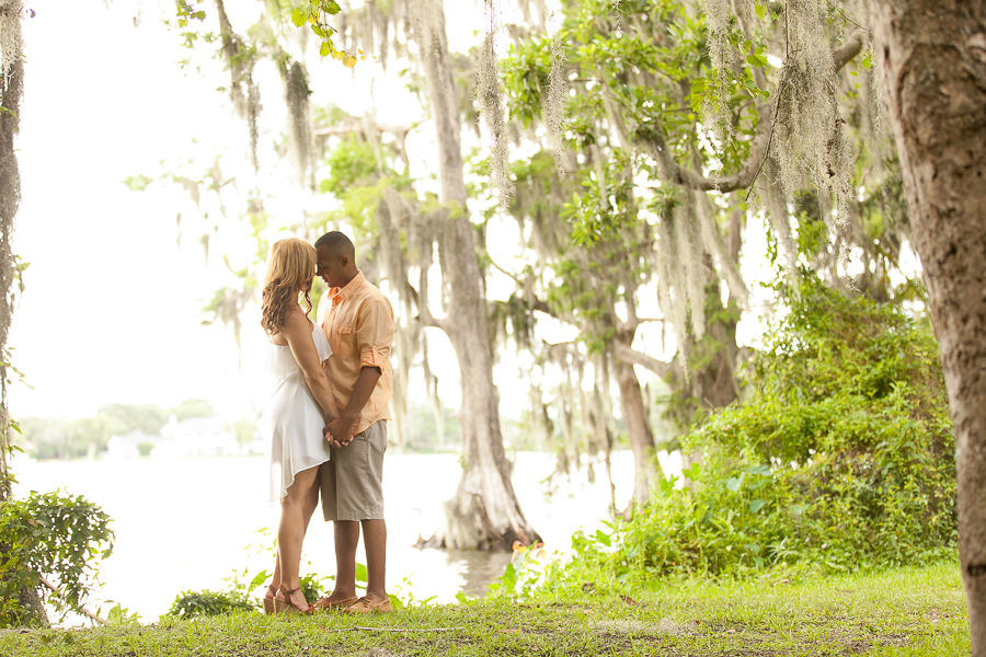 couple kissing by lake