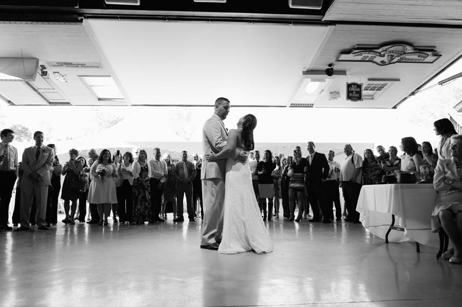 Black and white photo of the just married couple's first dance.