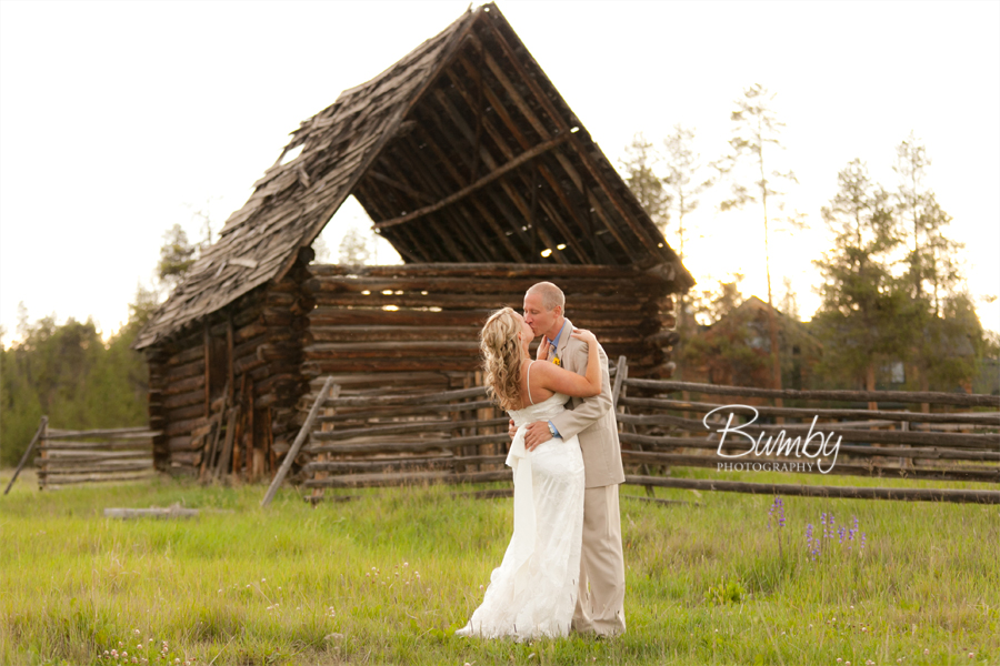 colorado wedding photographer couple kissing by old shanty