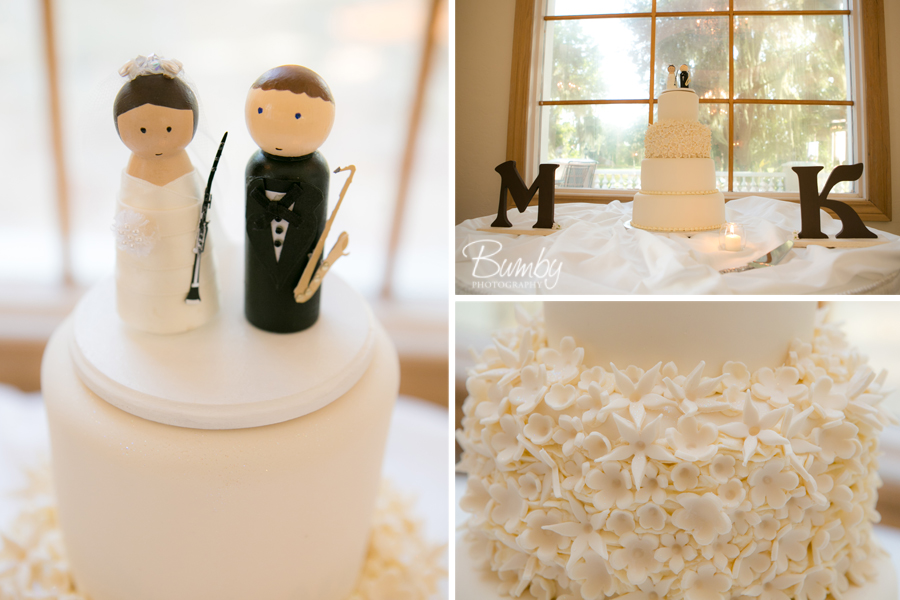 white fondant wedding cake with bride and groom cake topper holding instrustments