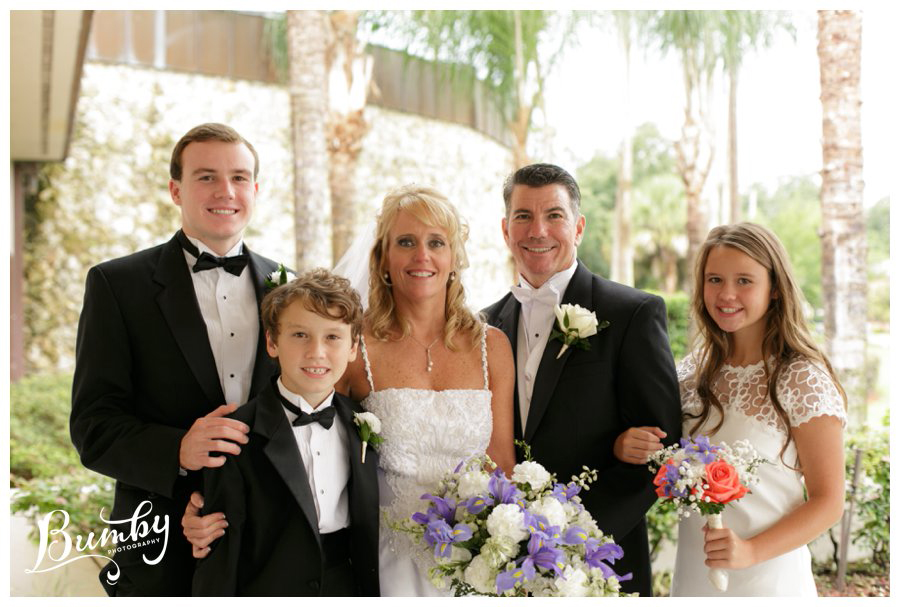 bride and groom with 3 children 20 year vow renewal