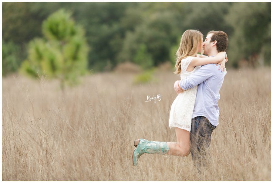 lake louisa state park engagement couple in open field kissing