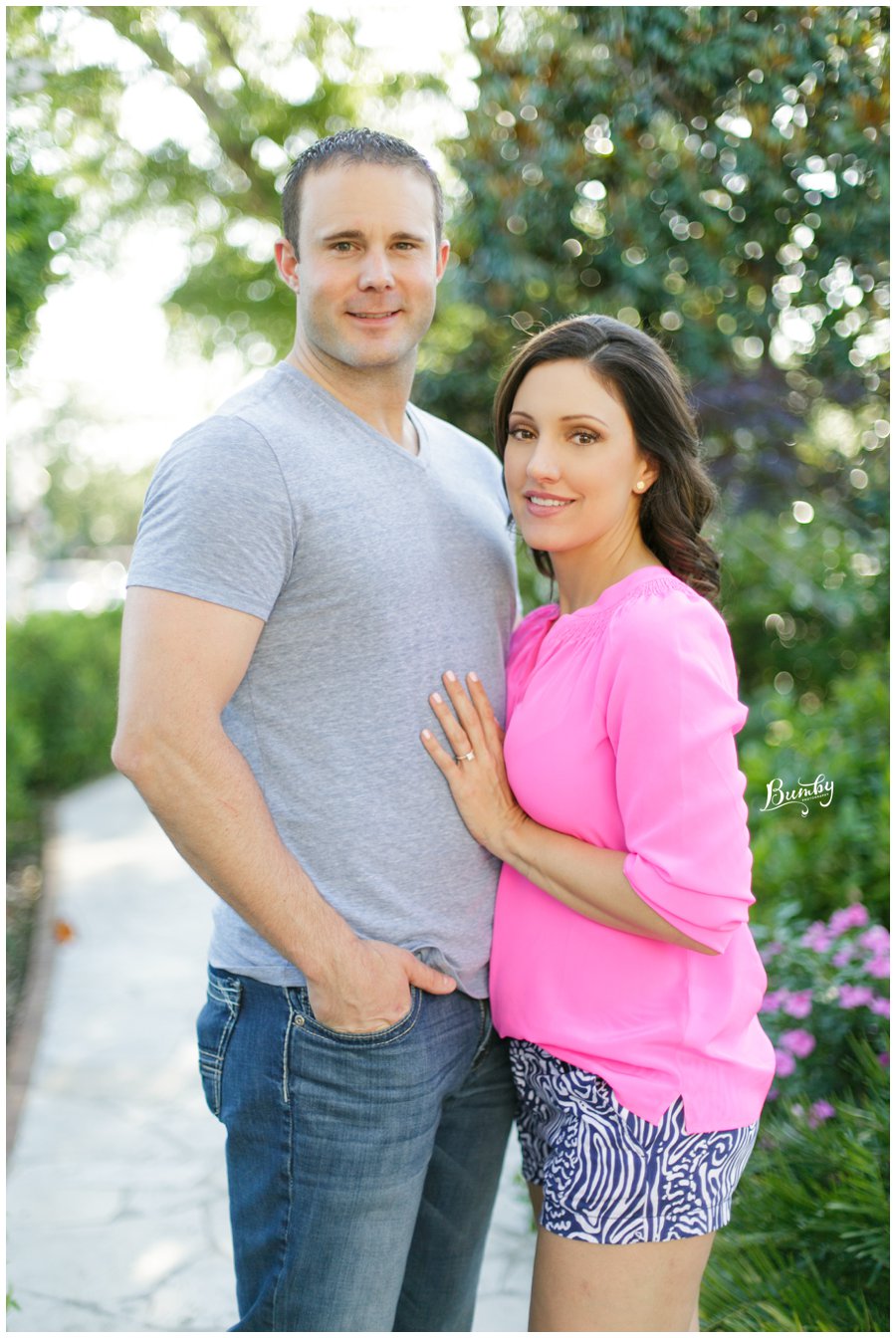 Couple posing with trees in the background at their Winter Park engagement session. 
