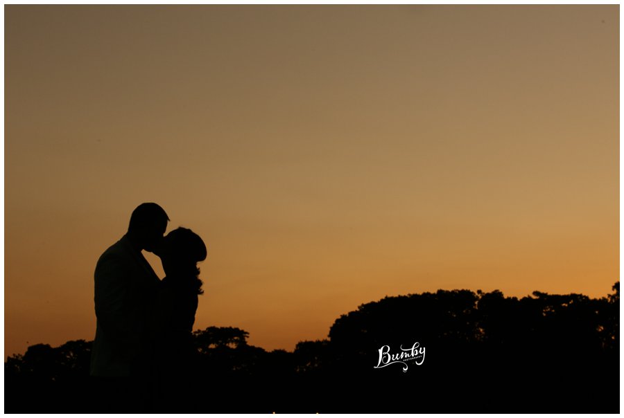 Couple kissing in the sunset. 