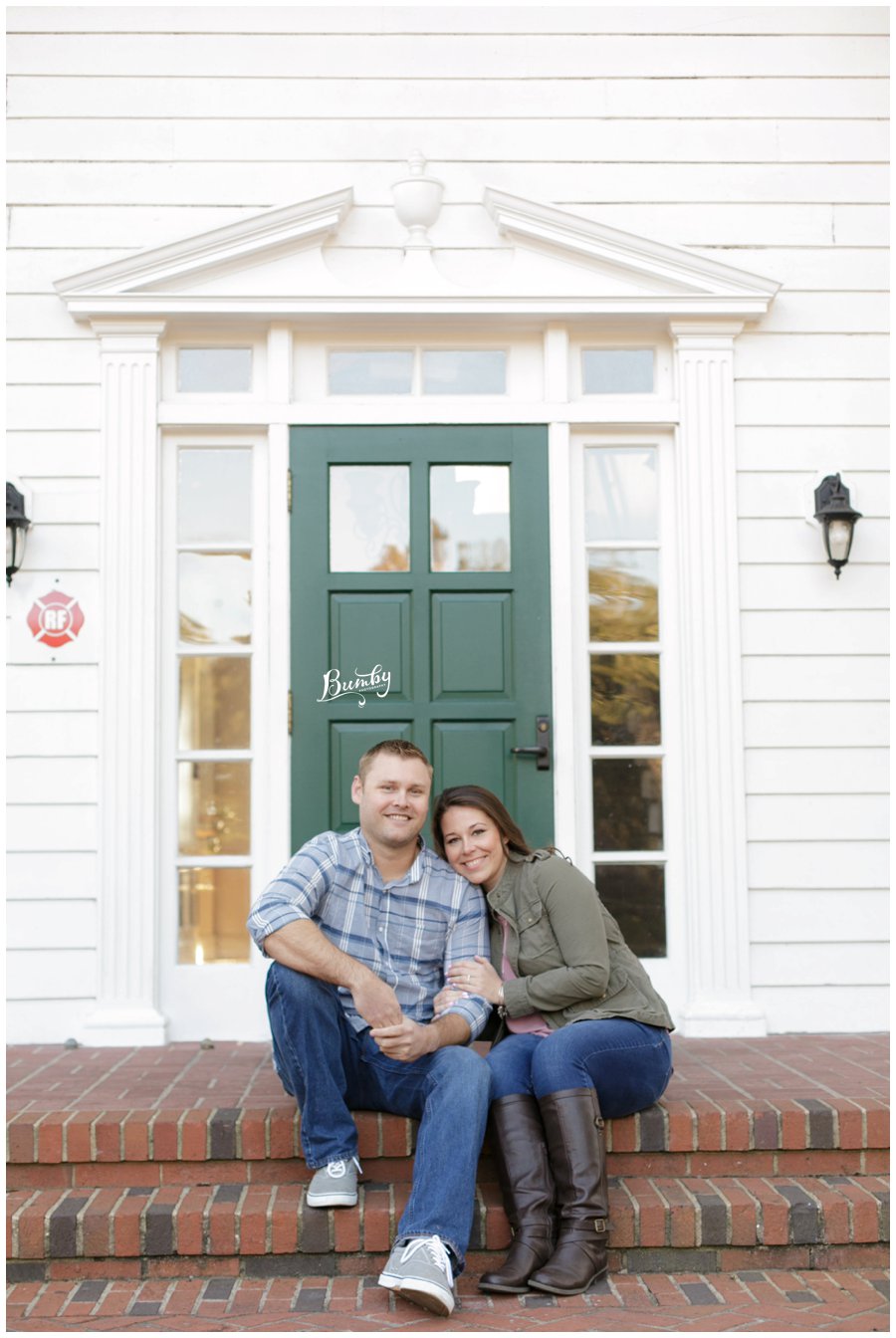 Cypress Grove Estate Orlando Engagement Session couple sitting in front of a green door.