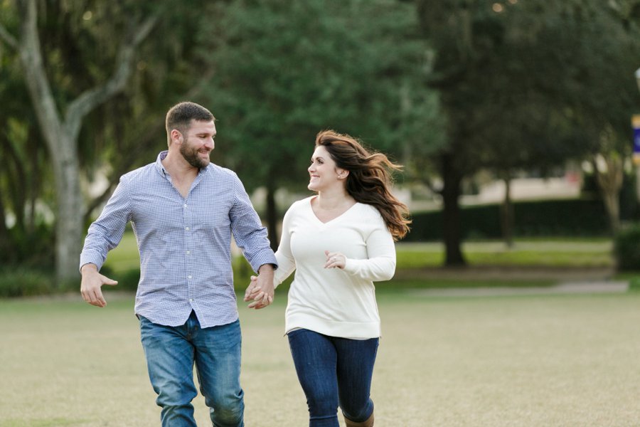 couple running together at rollins engagement