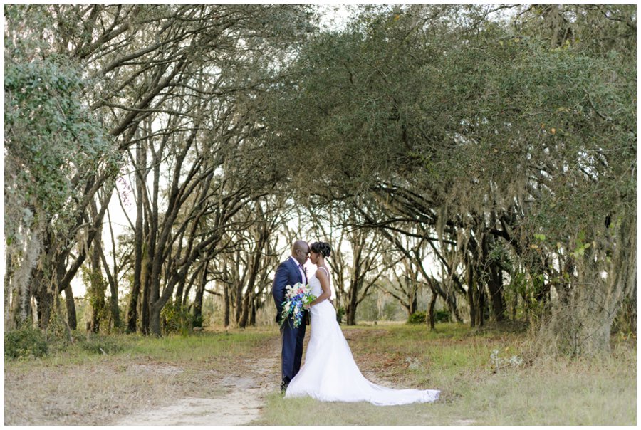 Wedding couple underneath oak trees
