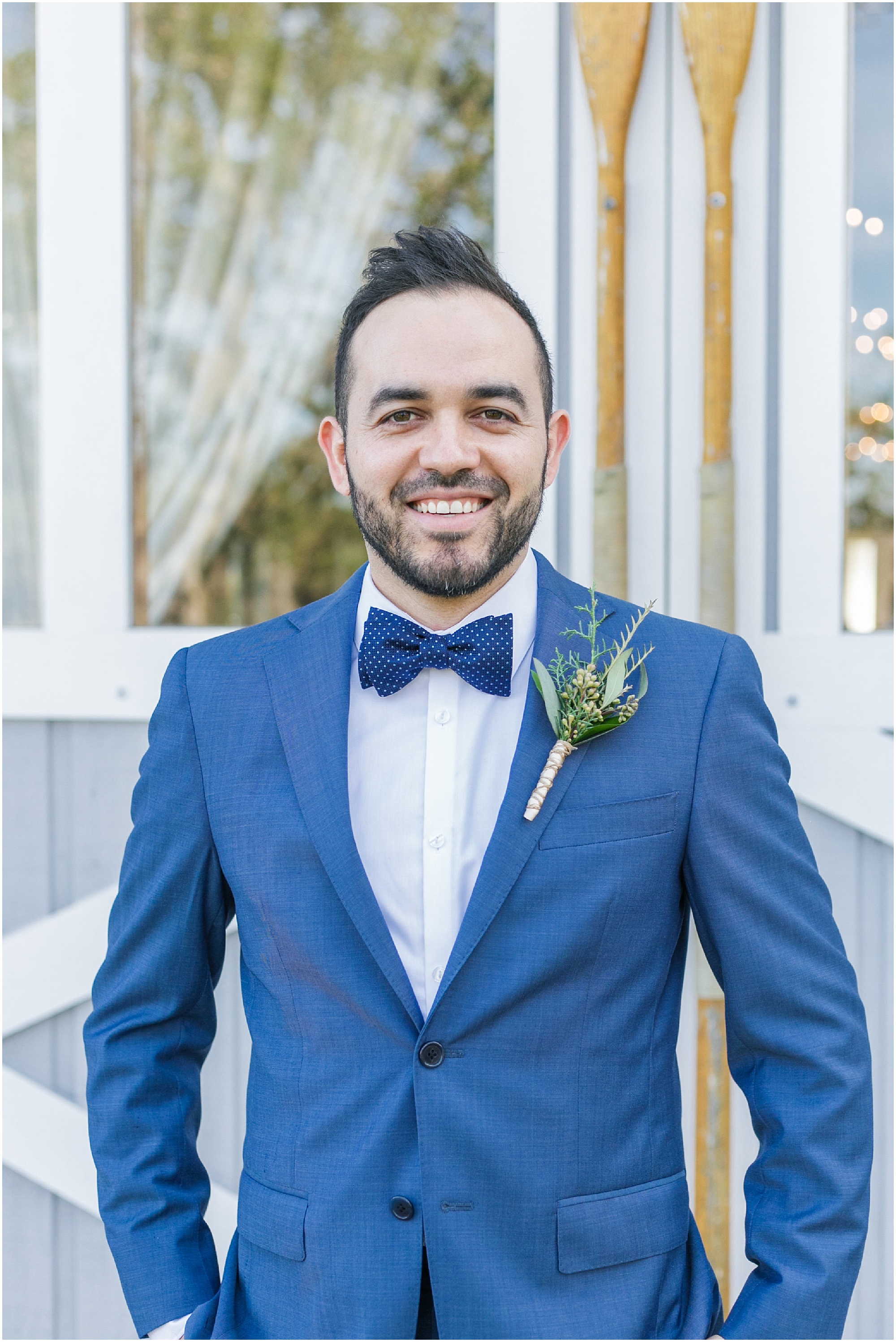 Groom in blue suit on wedding day