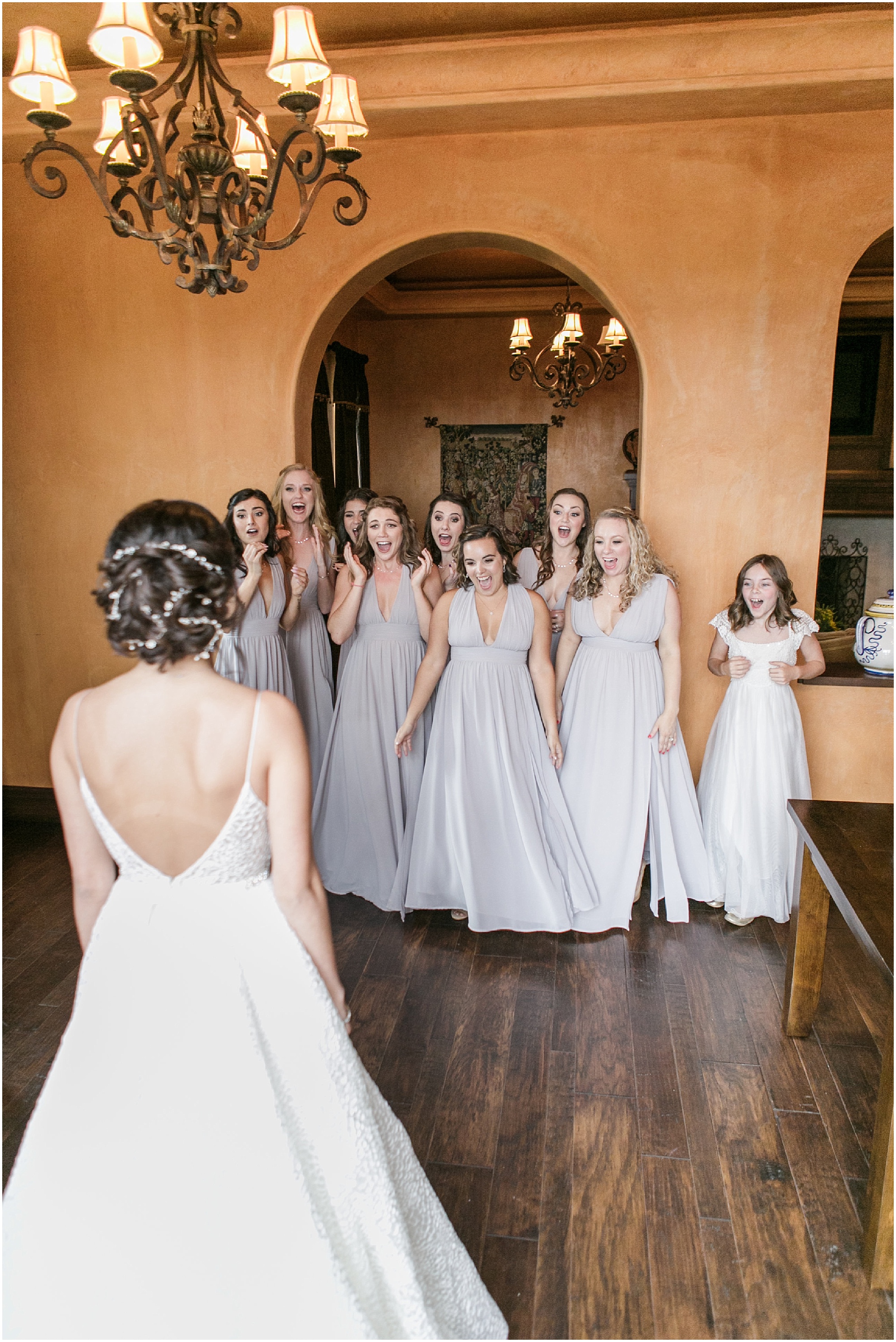 Bridal party turning around and being surprised by the bride in her final look. 