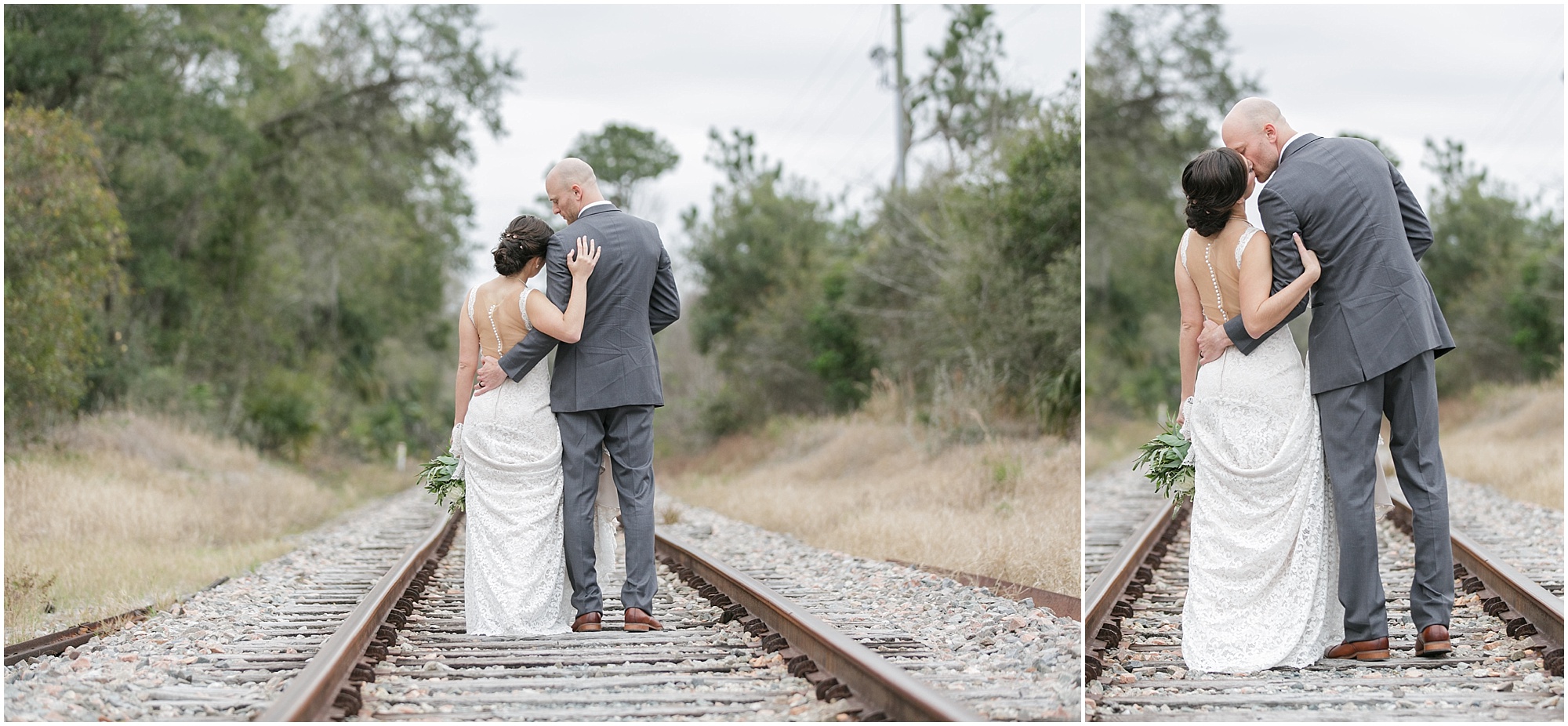 Couple kissing while walking along abandoned railroad tracks.