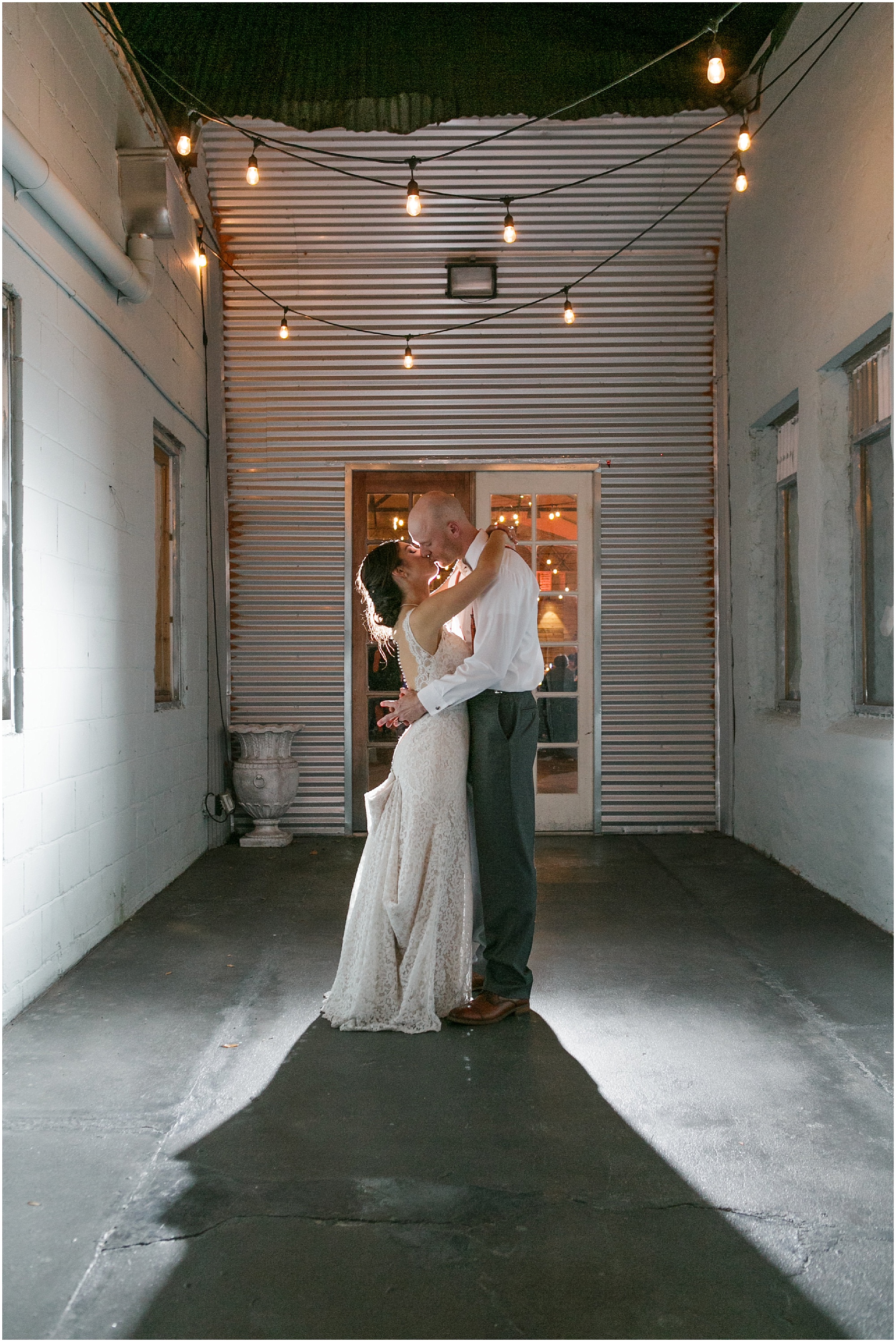 Downtown Orlando wedding couple sharing one more kiss at the end of the day.