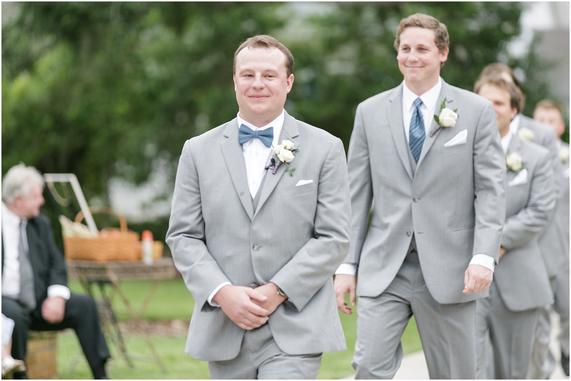 Groom walking in to the ceremony with his groomsmen.