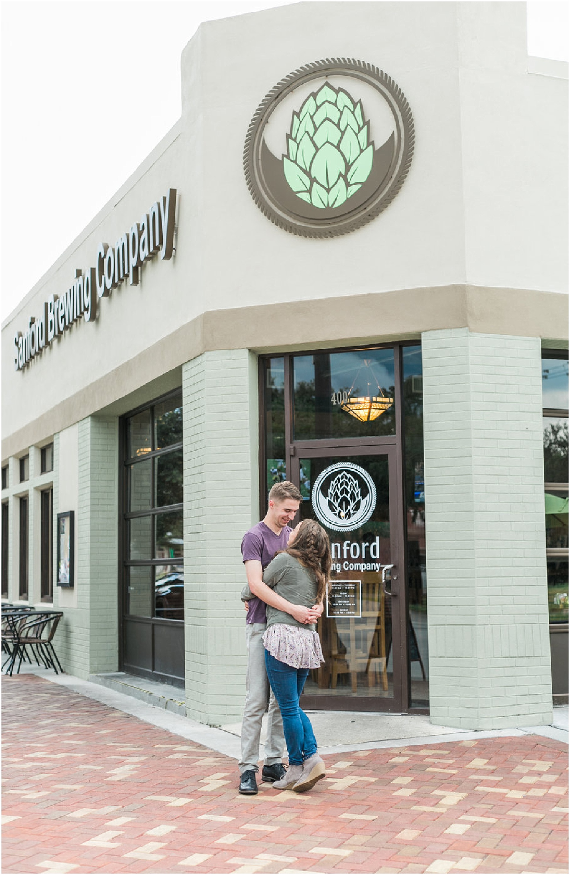 Couple hugging in front of the Sanford Brewing Company