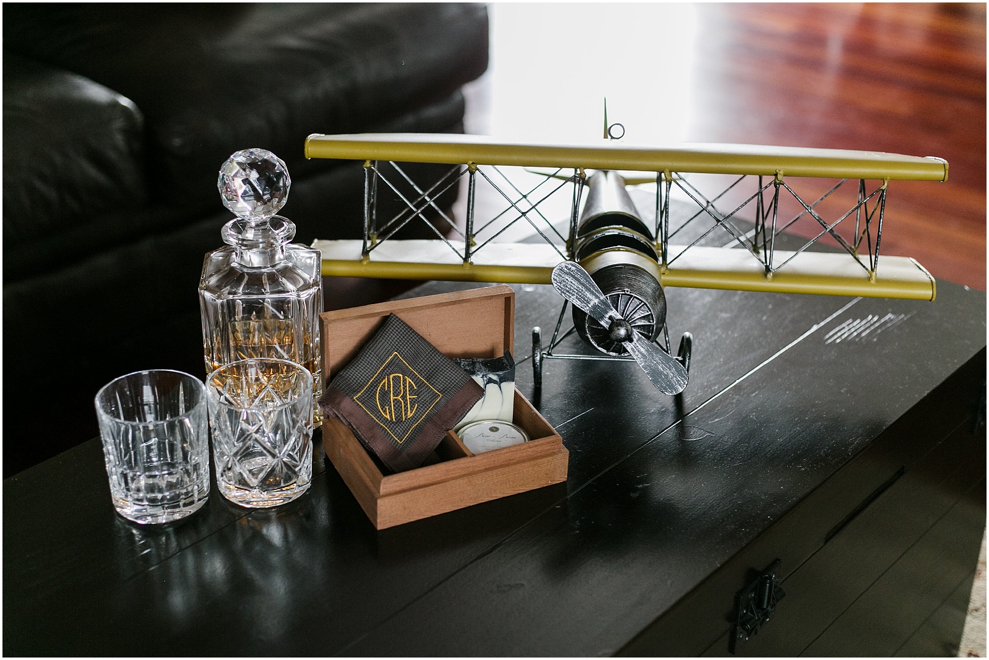 Groom's accessories including a handkerchief, a liquor set and model airplane. 