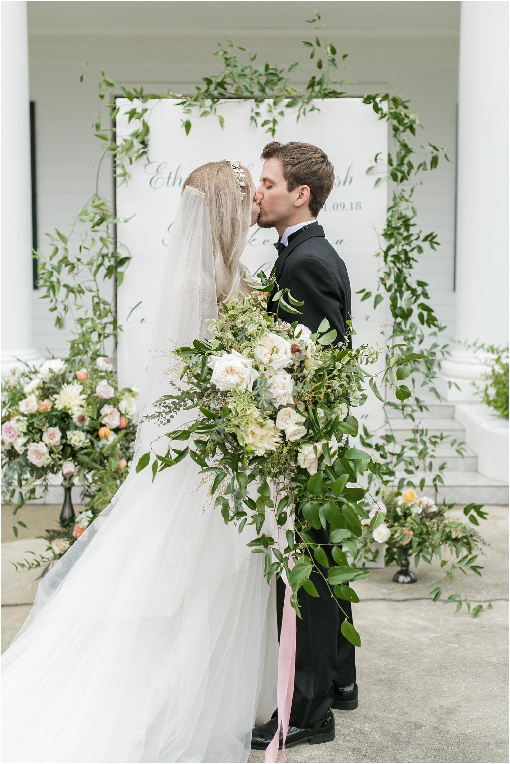 Bride and groom share their first kiss after being married. 