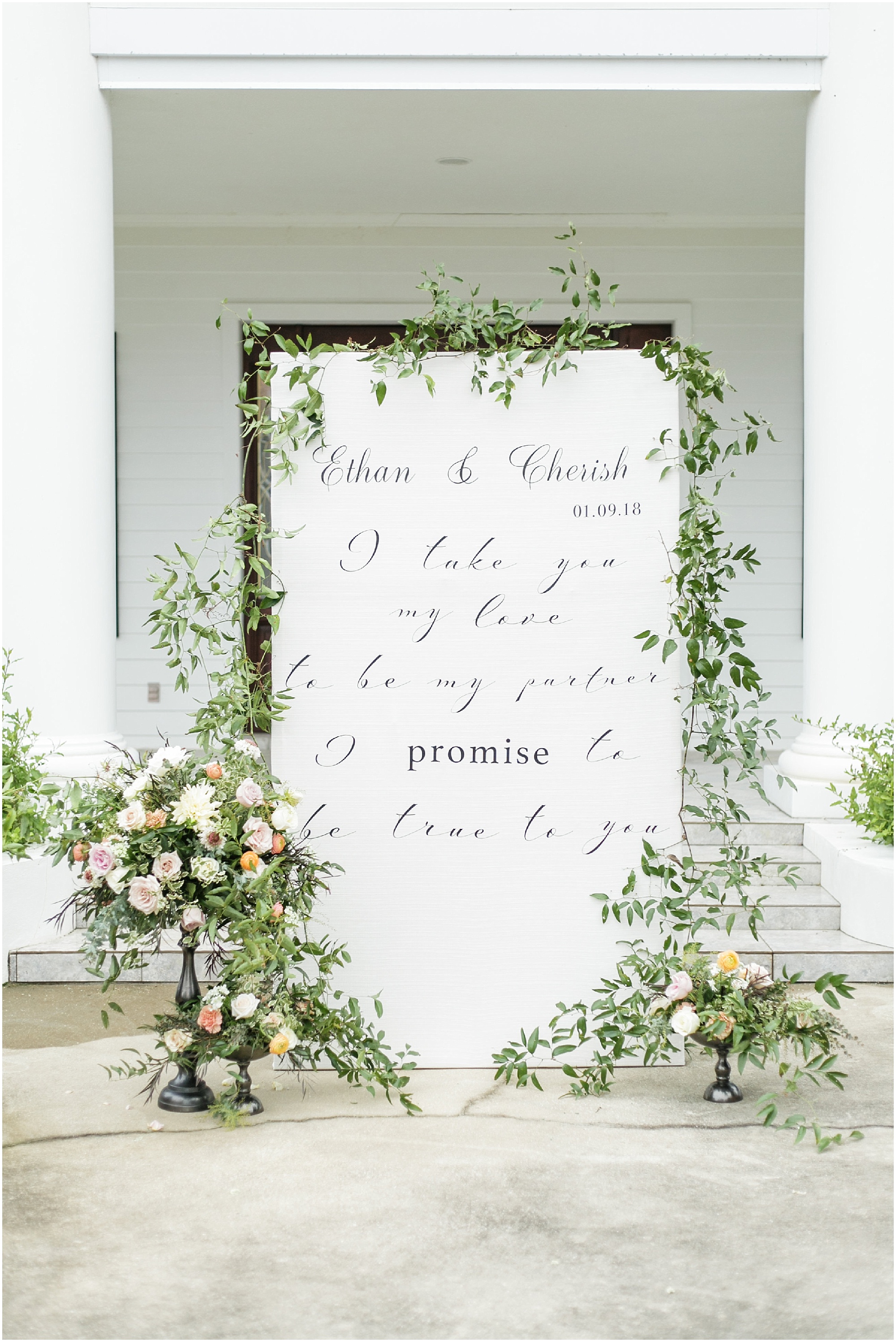 Timeless Southern Wedding large ceremony backdrop with the couple wedding vows printed on it. 