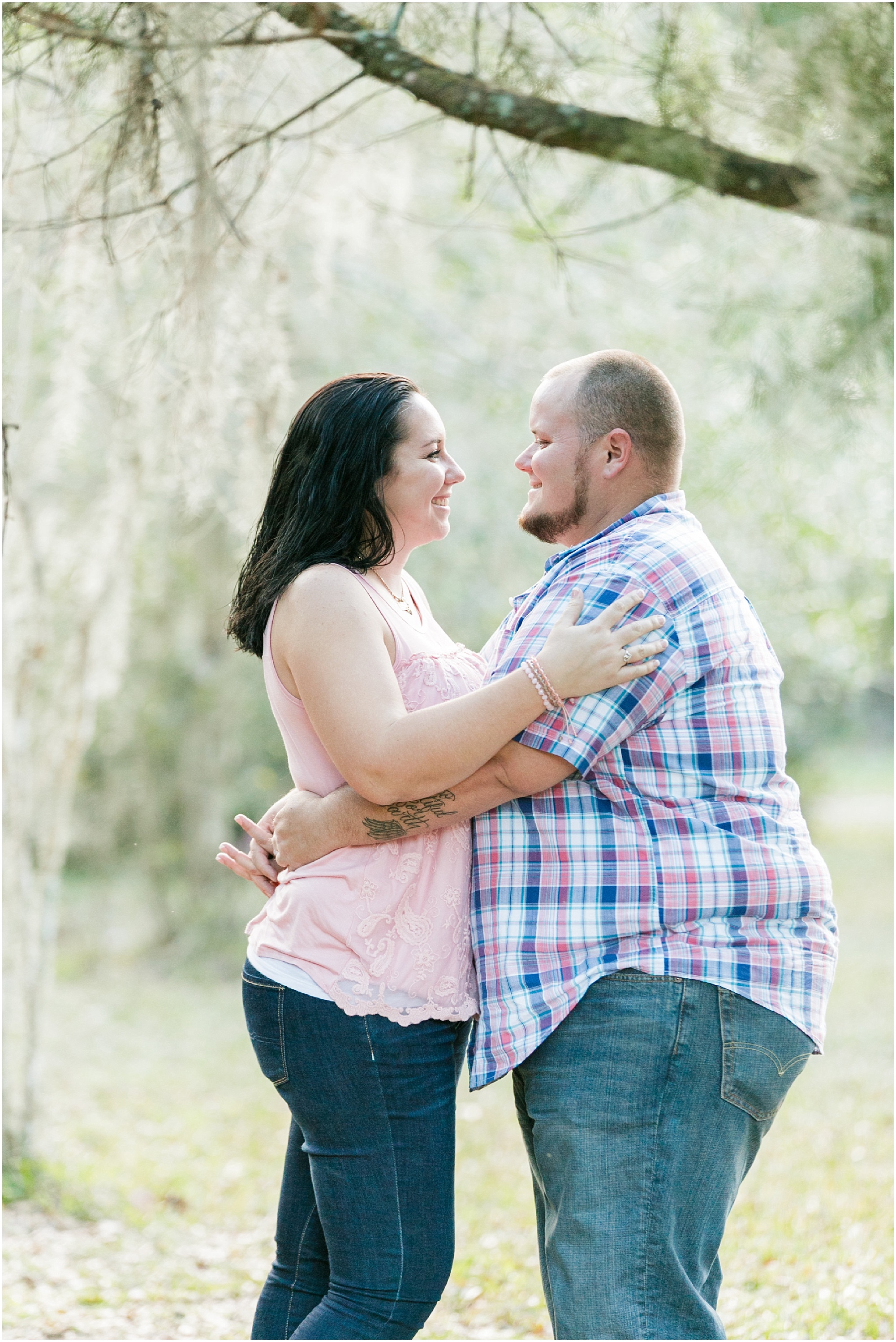 Monster Truck Engagement Session holding each other and smiling at each other. 