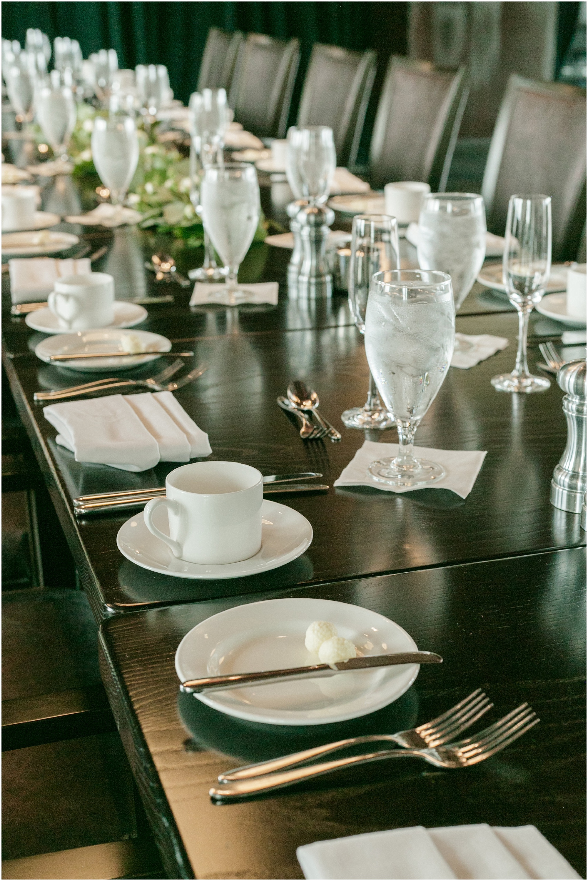 Long table at the Eleven restaurant set up for an intimate reception. 