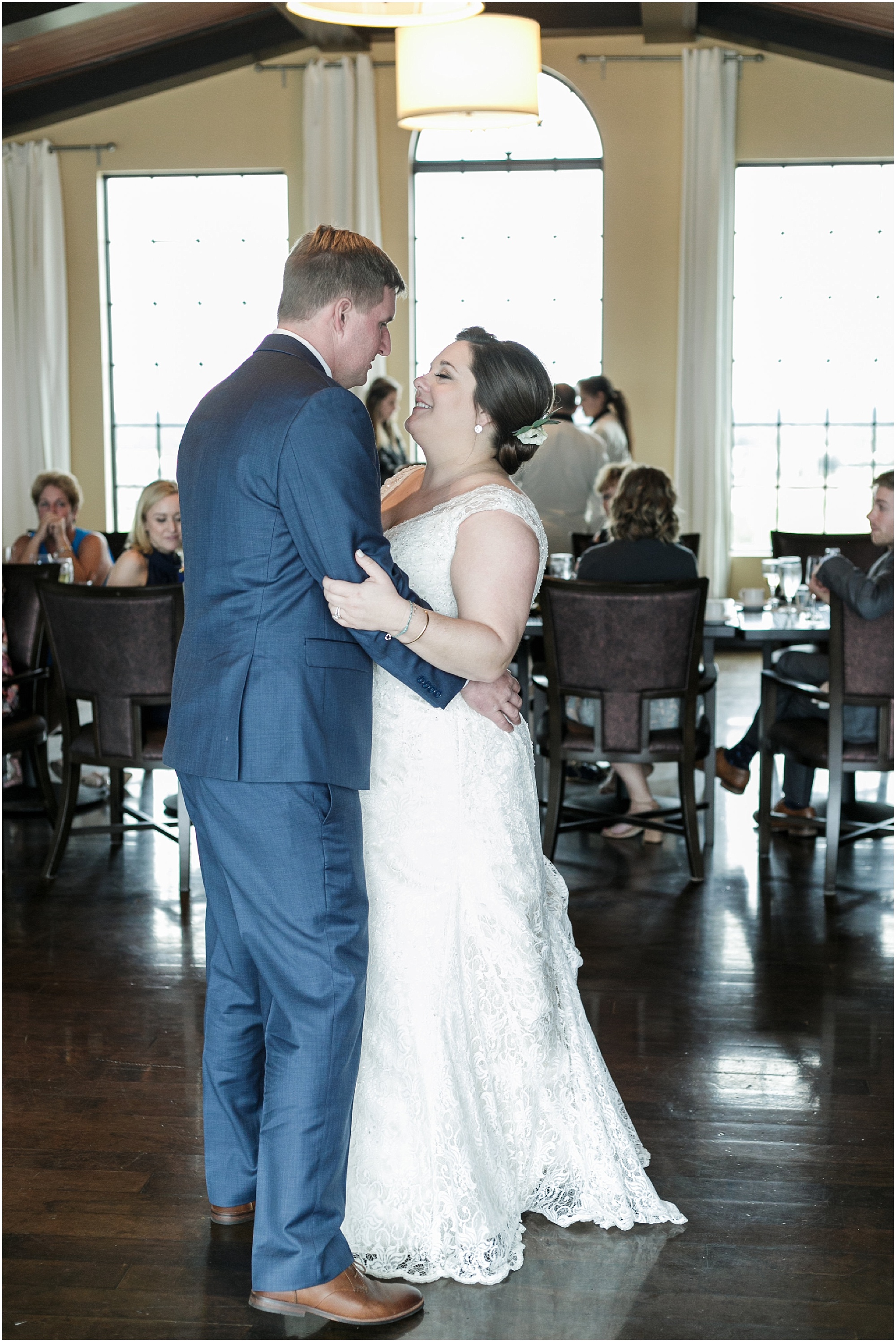 Bride and groom share their first dance as husband and wife at their rooftop reception. 