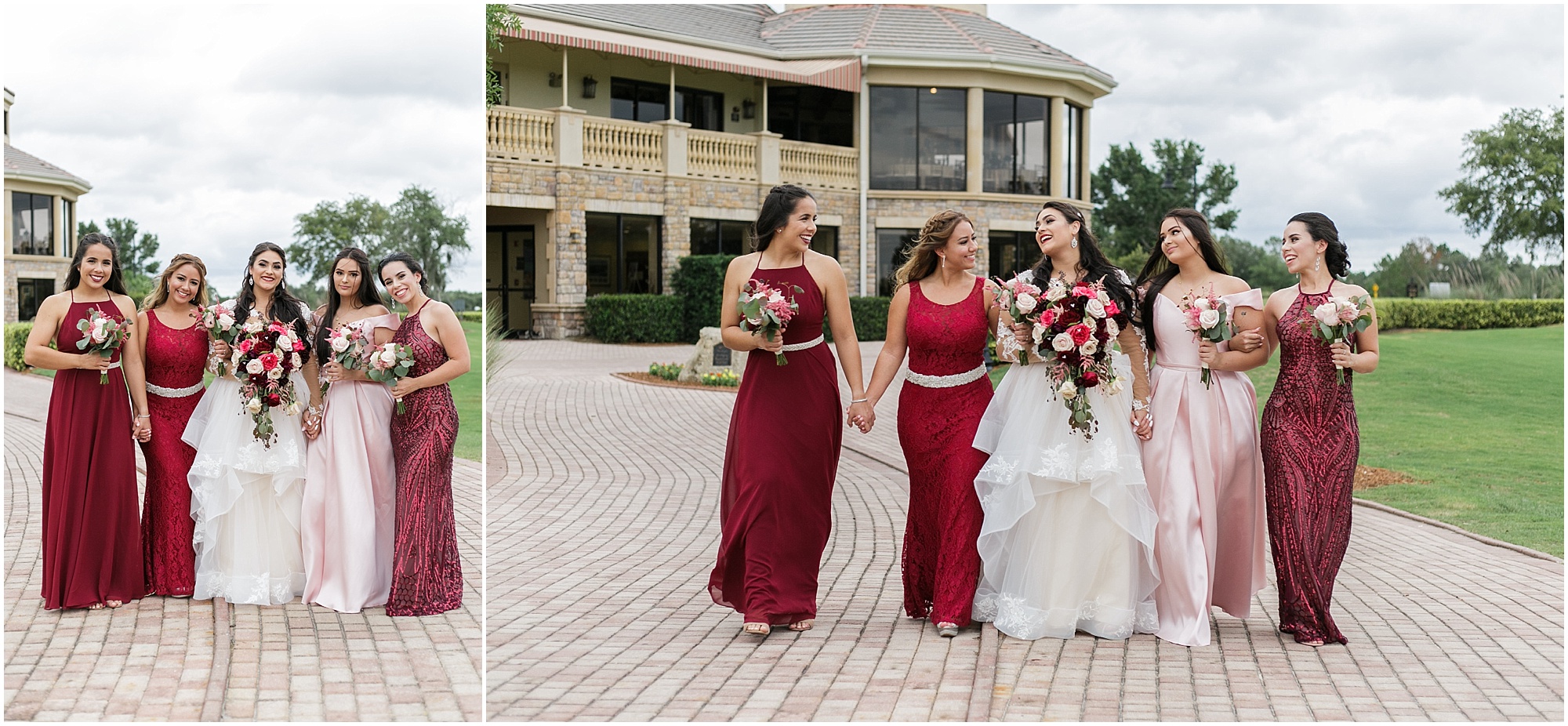 The brides wedding party in mismatched dresses in shades of reds and pinks. 