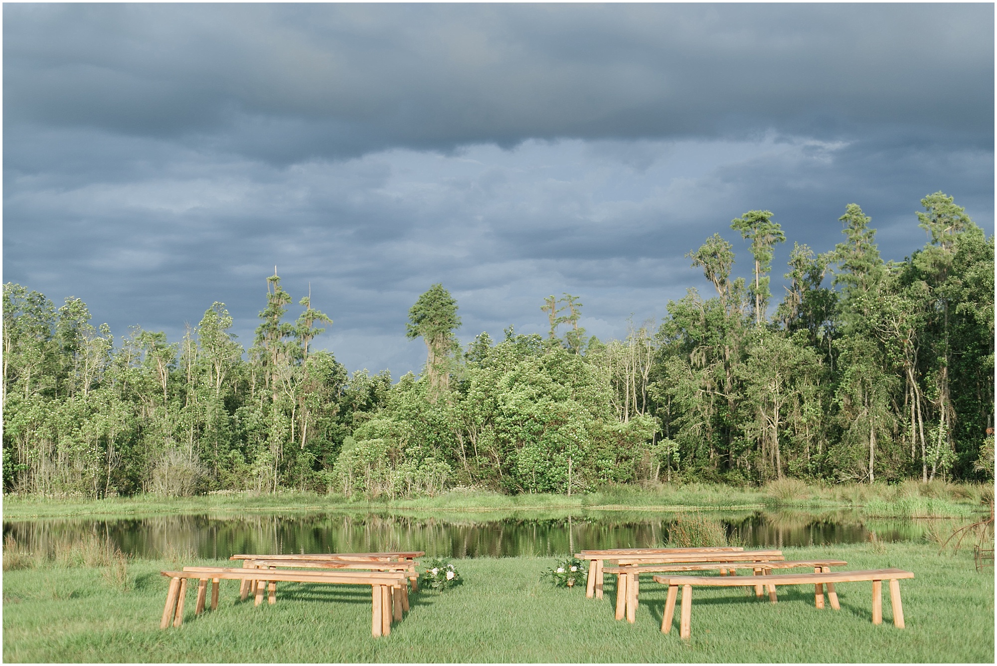 Outdoor ceremony space with a storm in the background.