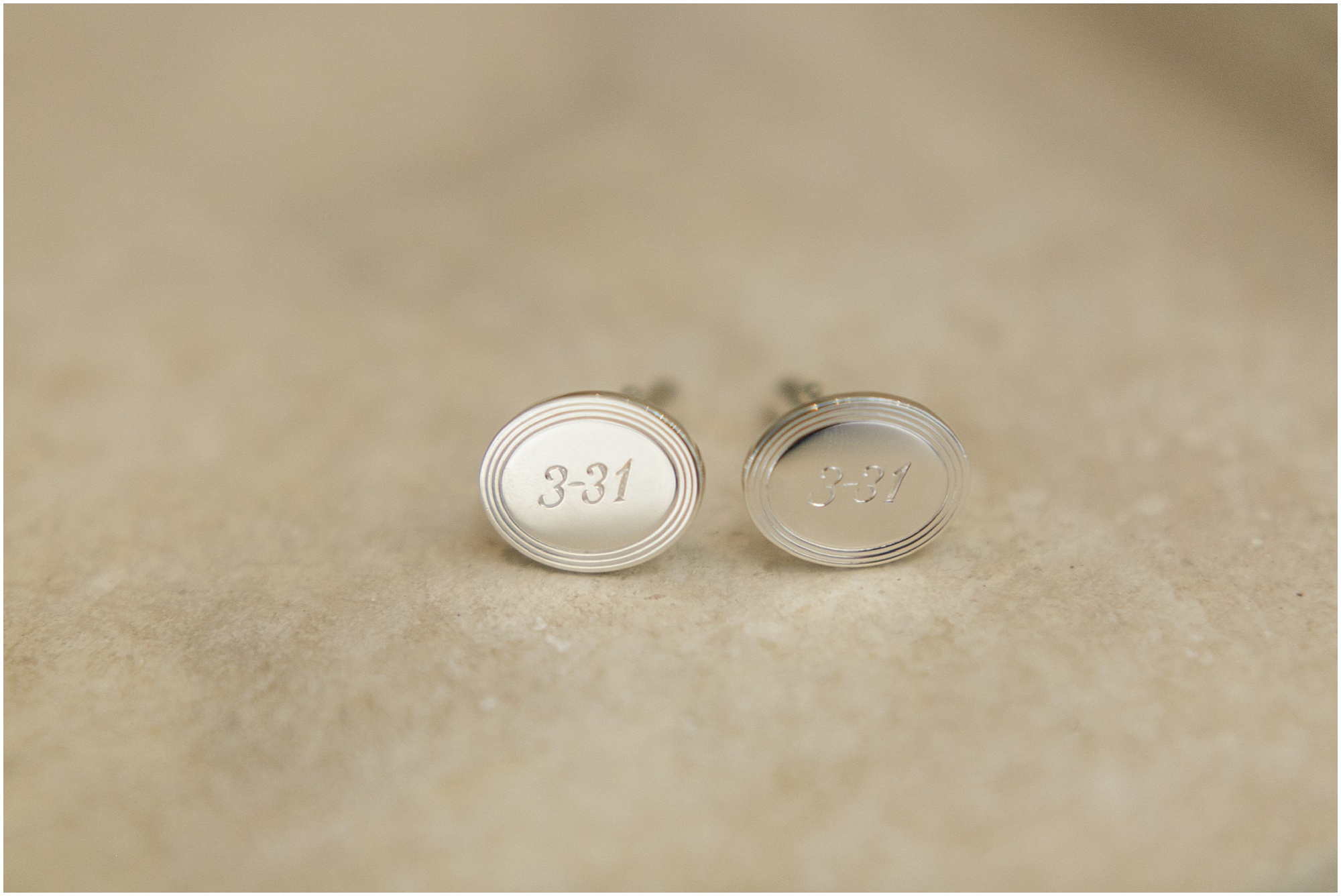 Grooms cufflinks with his wedding date engraved in them. 