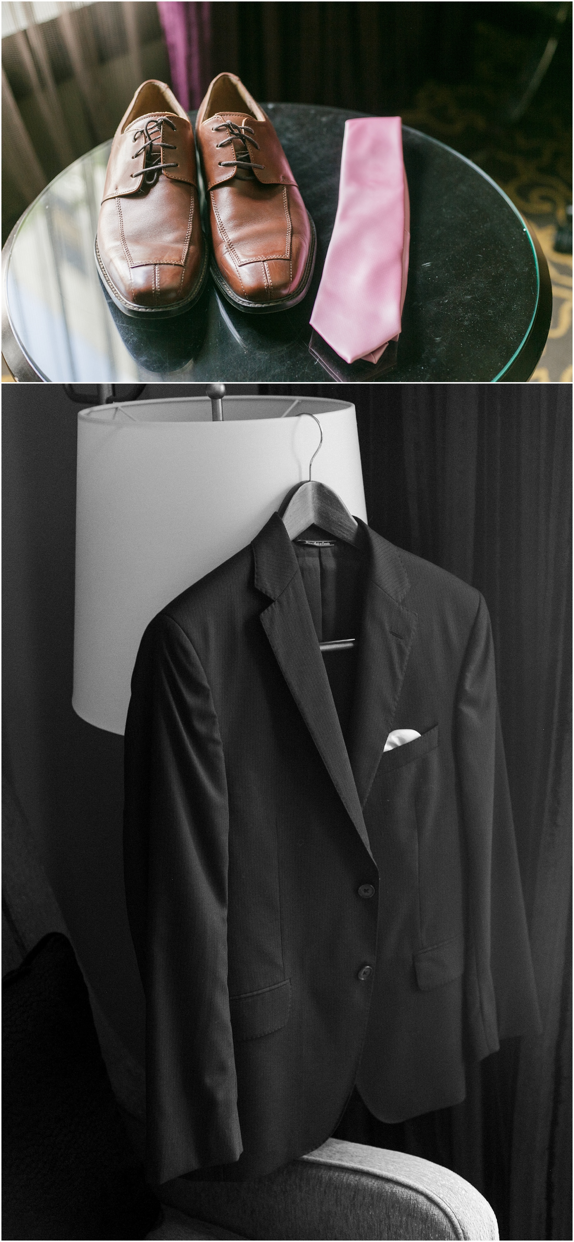 Grooms brown shoes and pink tie sitting on a glass table and a black and white photo of the groom's jacket hanging on a lamp. 