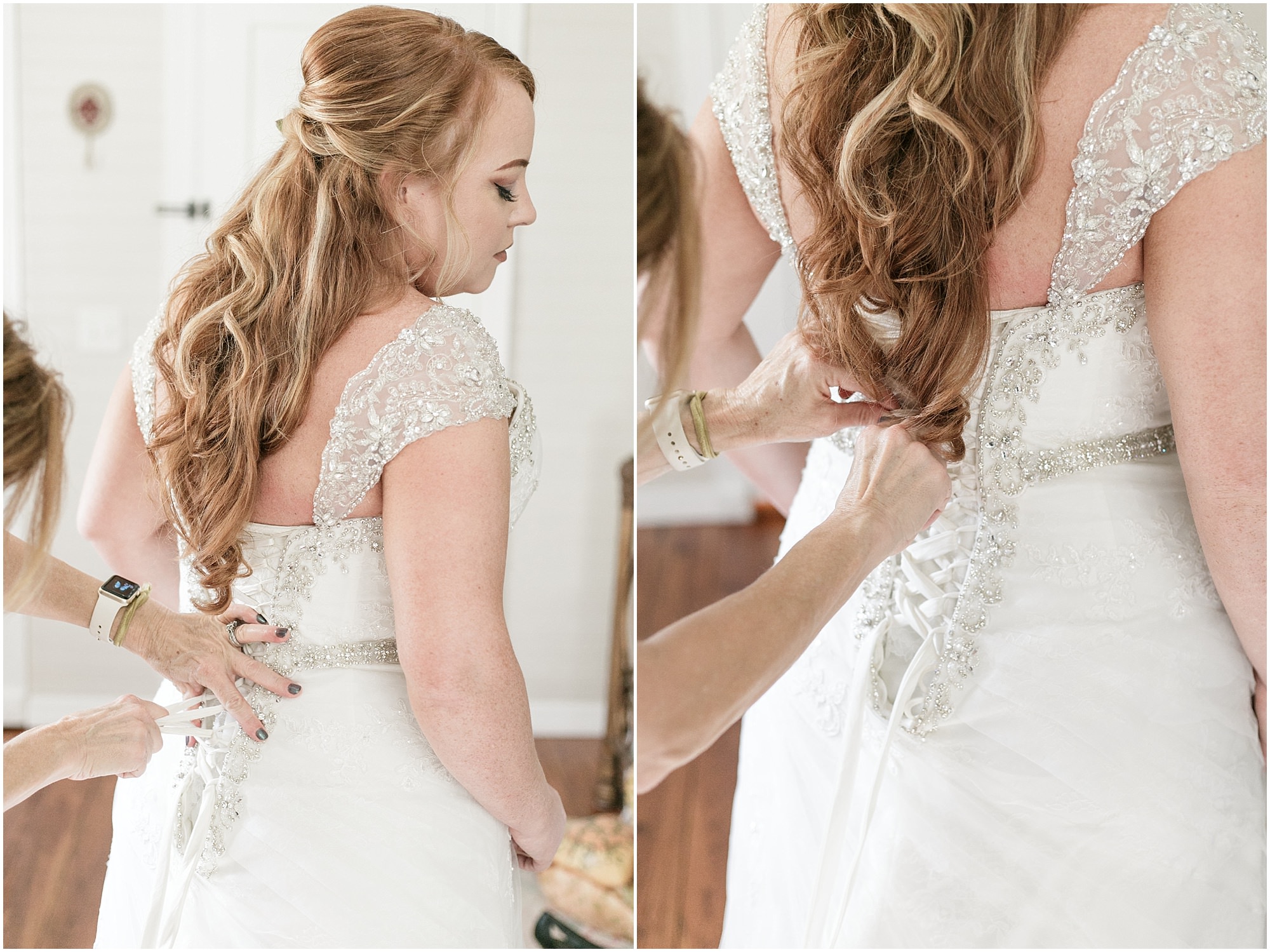 Finishing lacing up the back of brides wedding dress. 