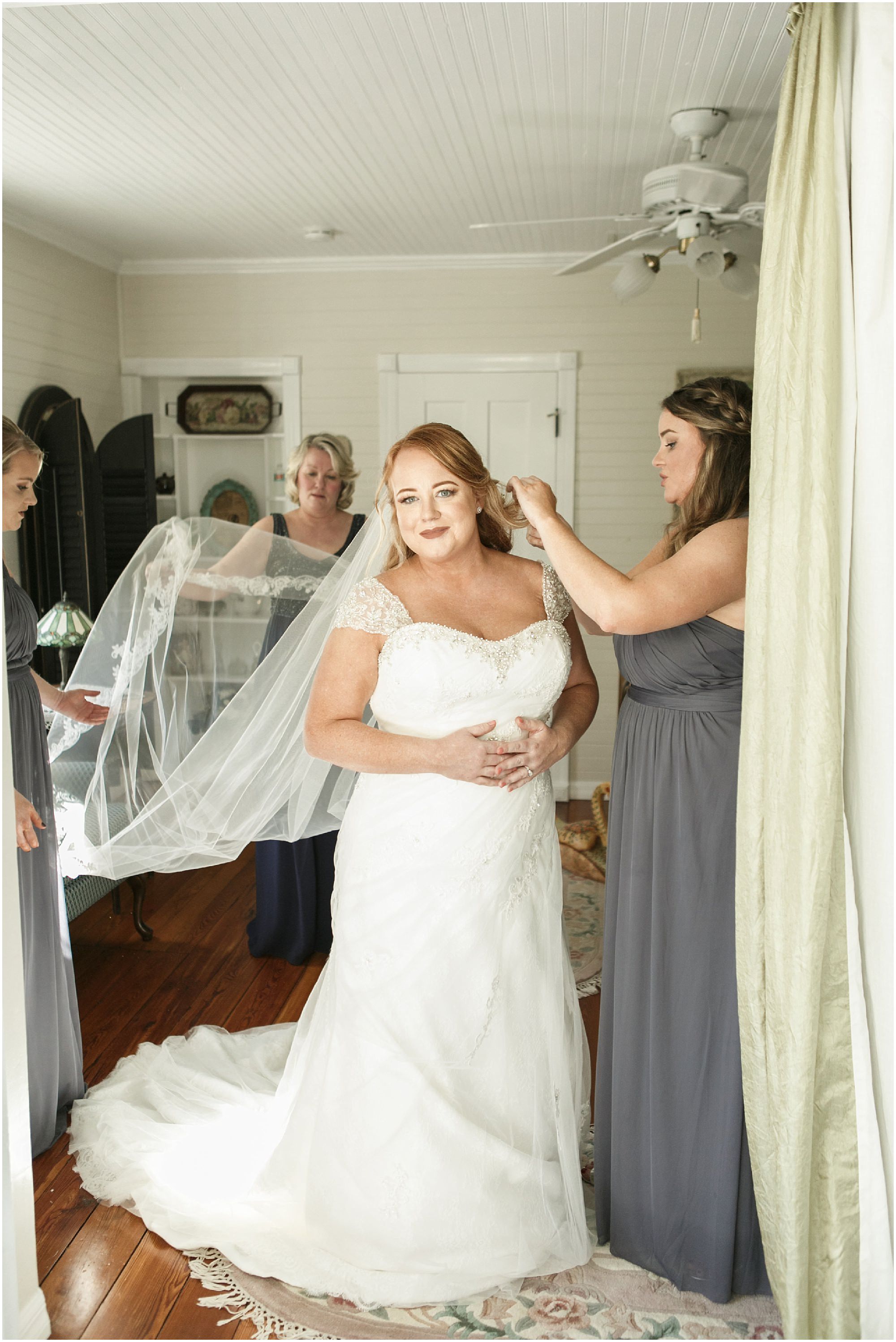 Bride in her wedding dress with the veil on. 