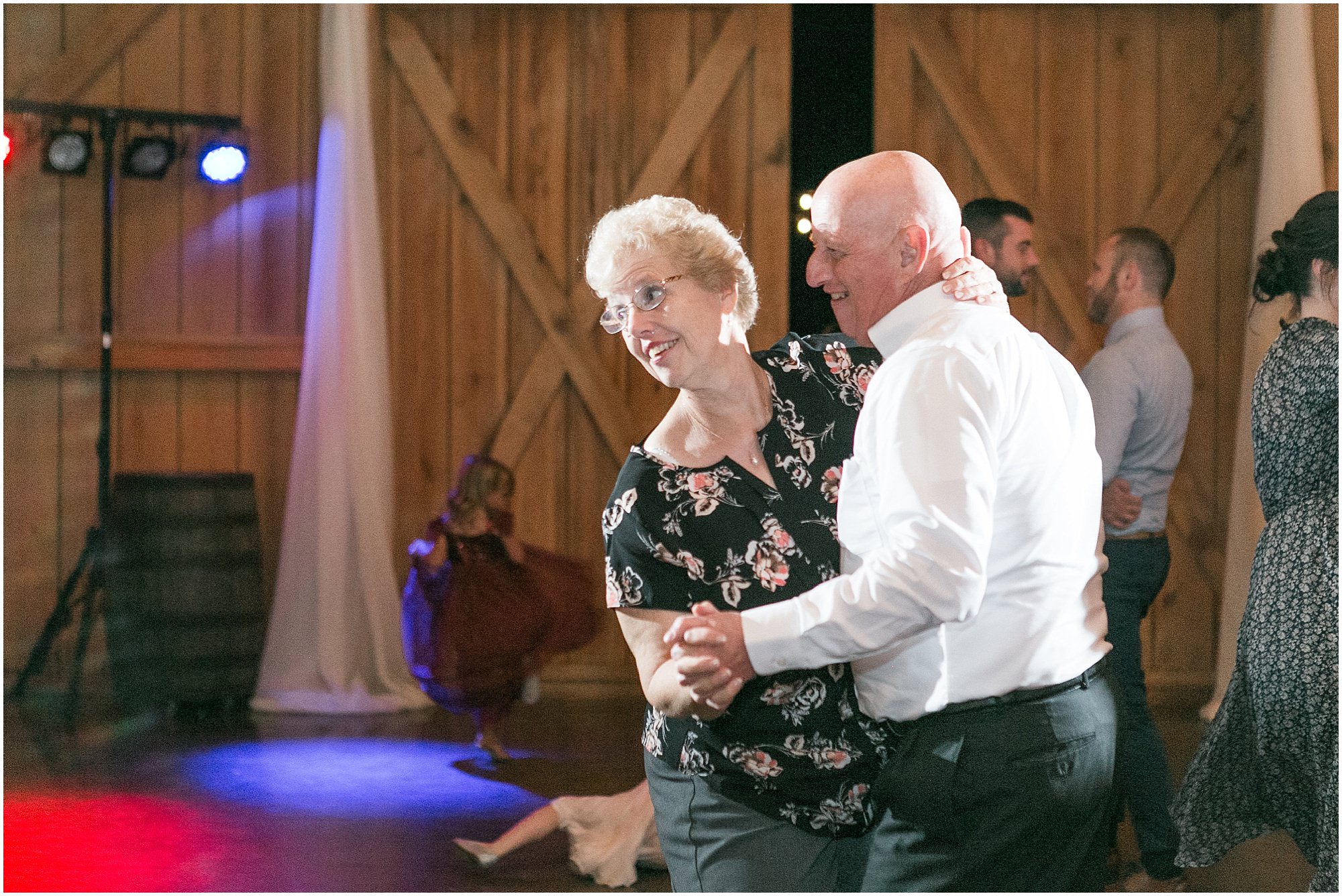 Bride's parents dancing and laughing 