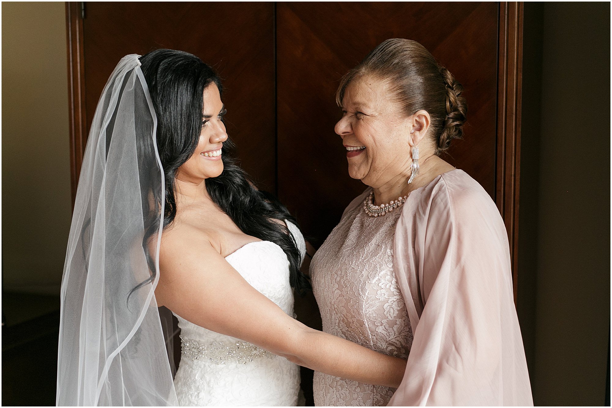 Bride looking at her grandmother and both smiling