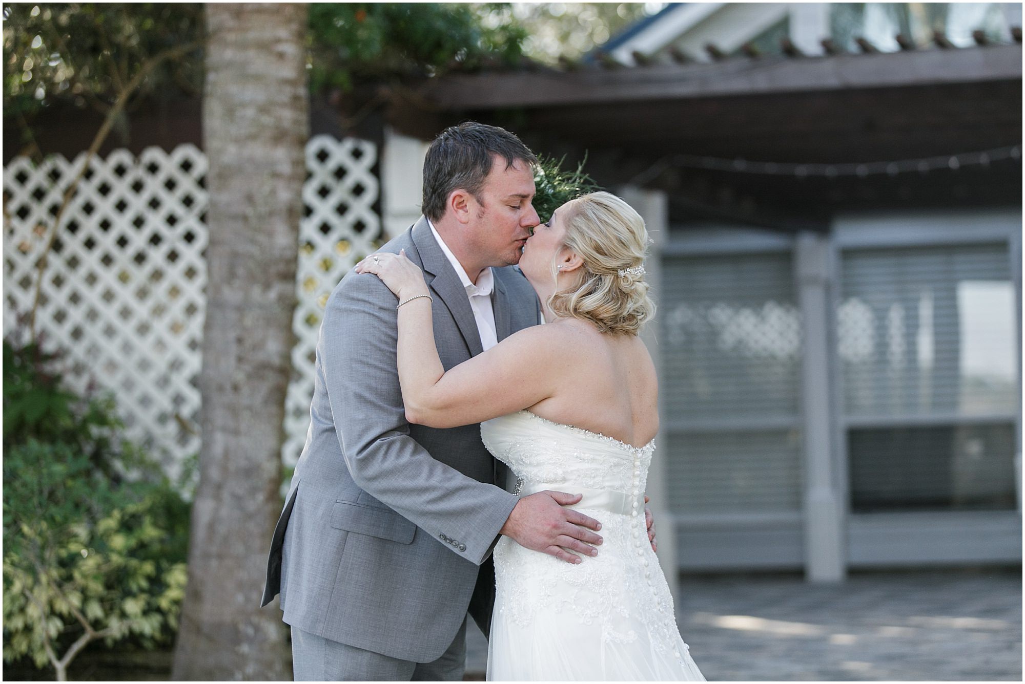 Bride and groom share a kiss after their first look.