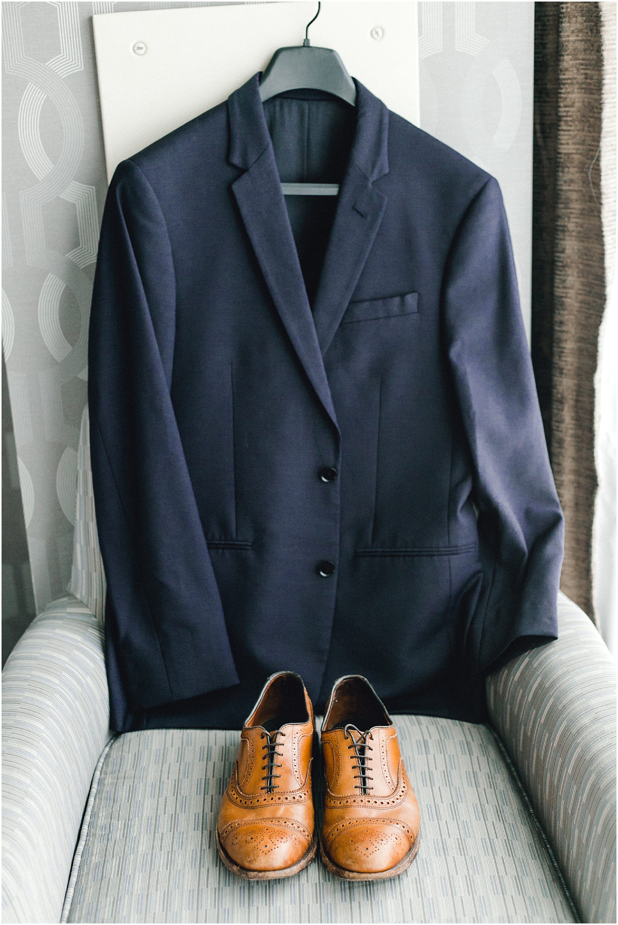 Grooms navy blue jacket and brown shoes