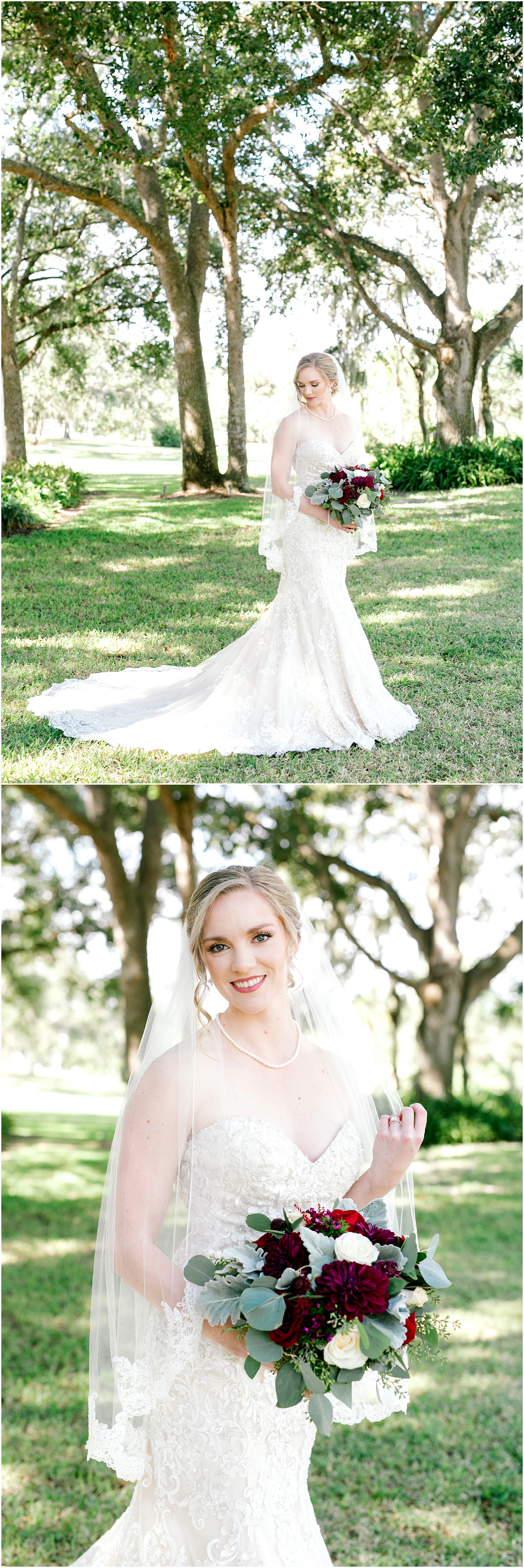 Bride standing in the grass under trees in her wedding dress