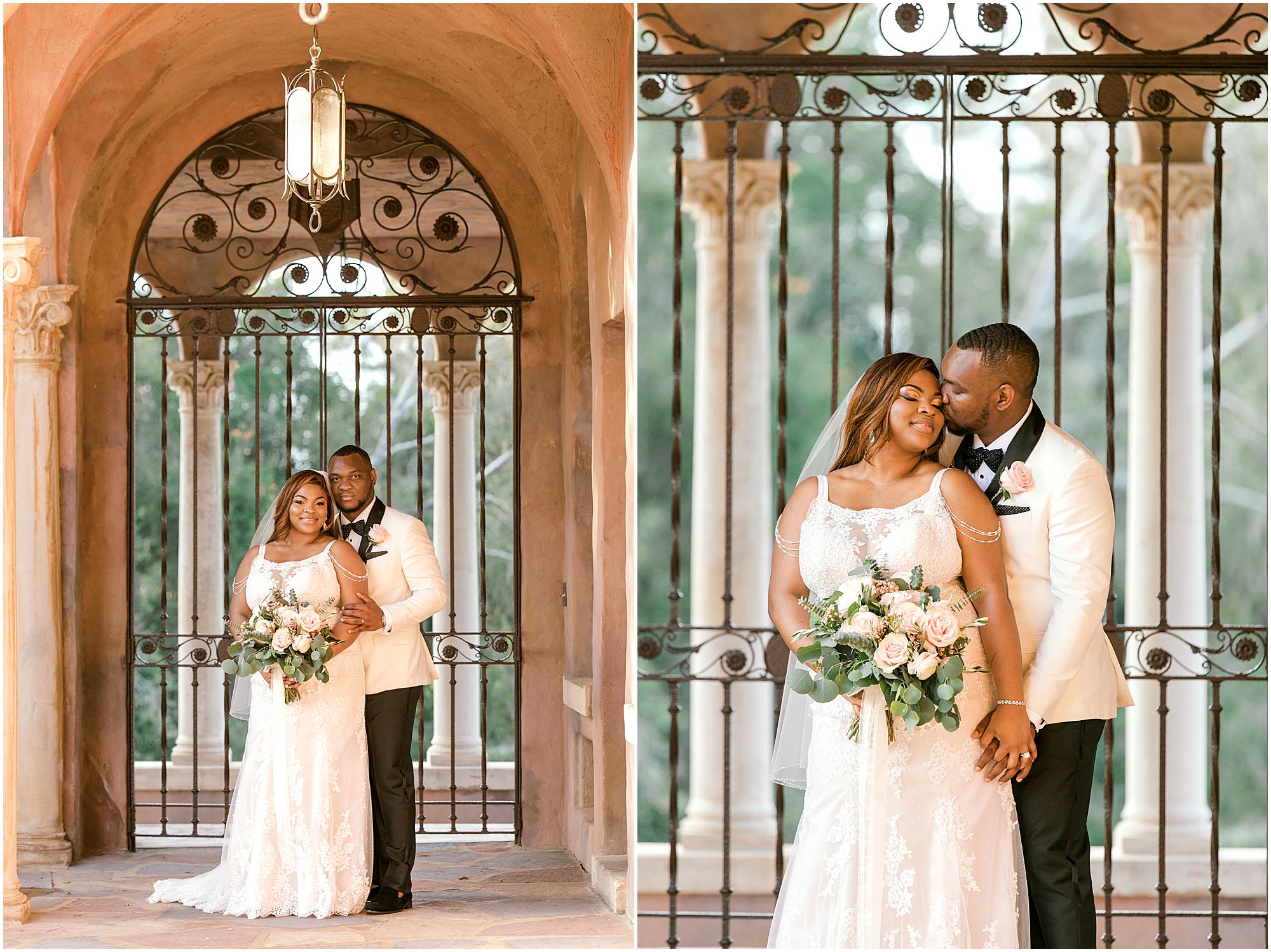 Bride and groom standing in front of antique iron gates