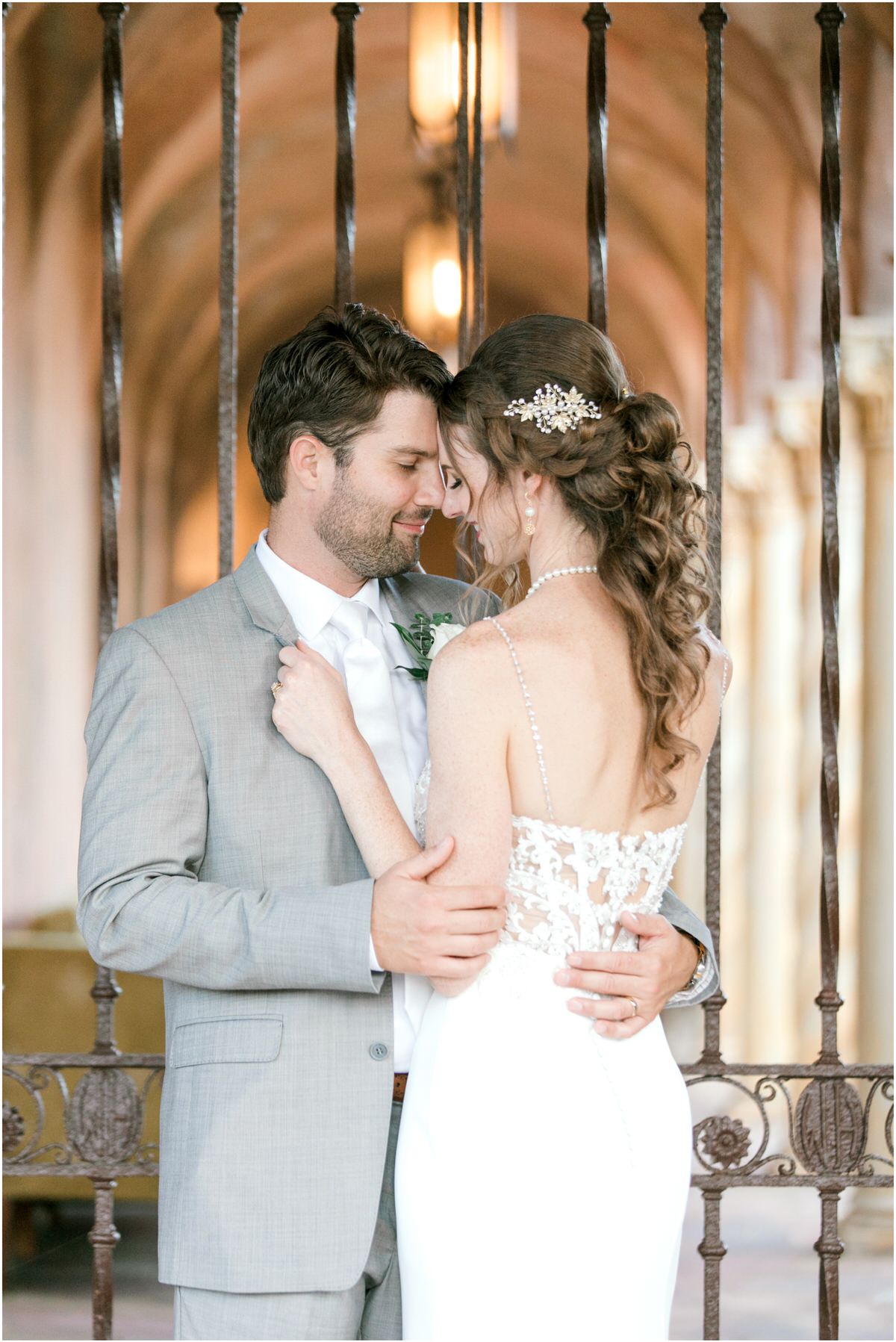 Elegantly intimate howey mansion wedding couple in front of iron gates