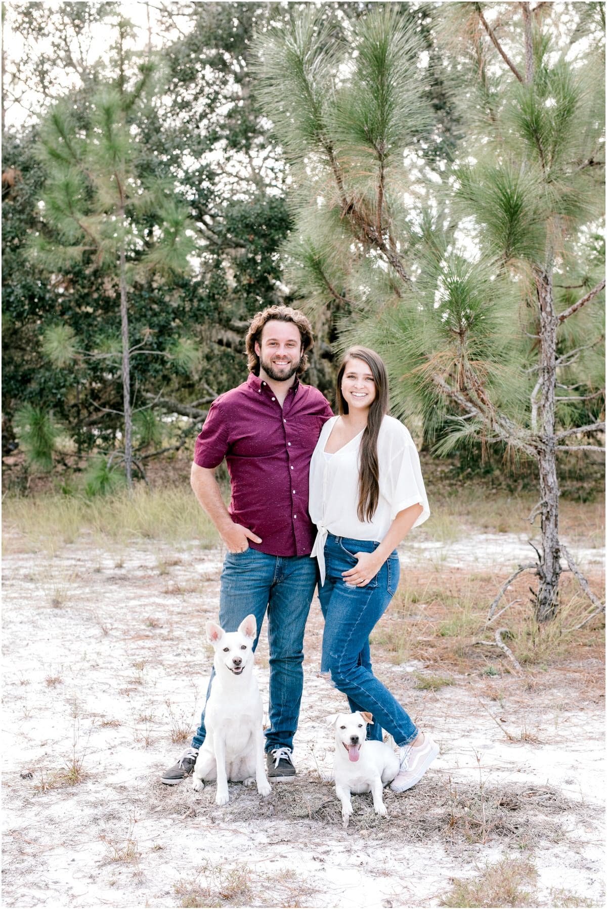 Lake Louisa Engagement Session couple and their two dogs outdoors