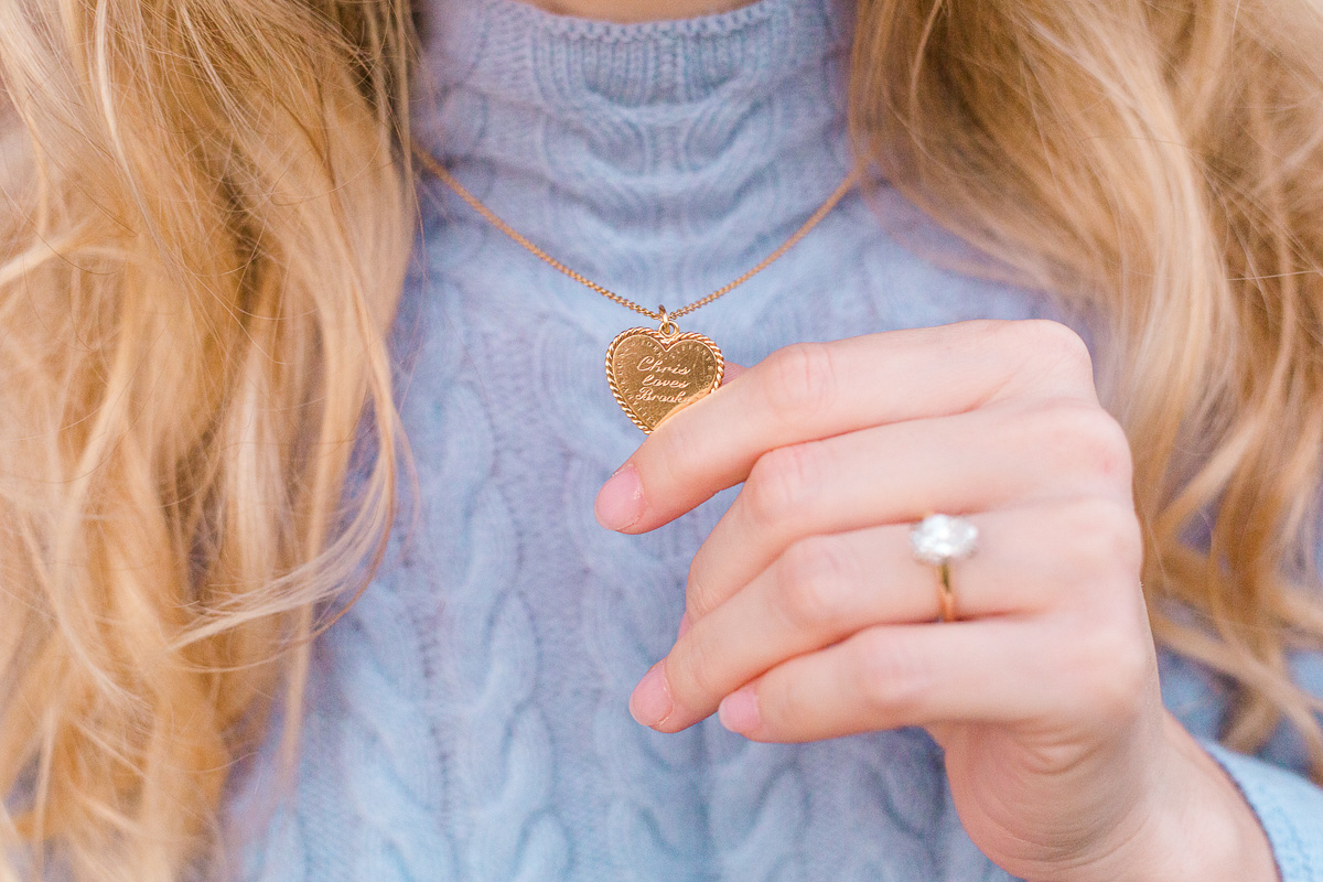 close up of a gold heart necklace