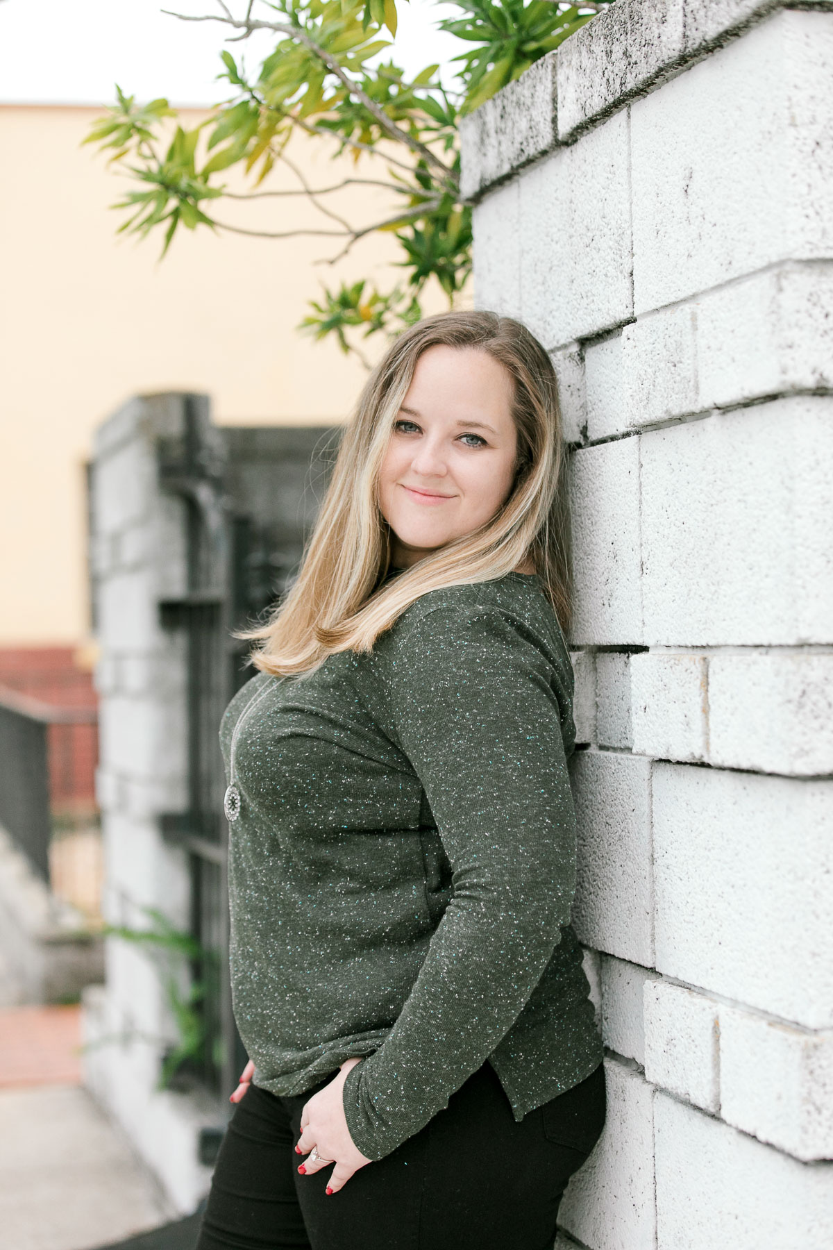 Portrait of a women in a green sweater at engagement session