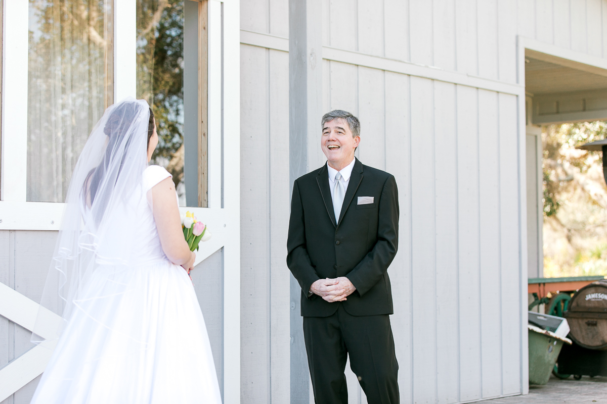 dad surprised by daughter in wedding dress