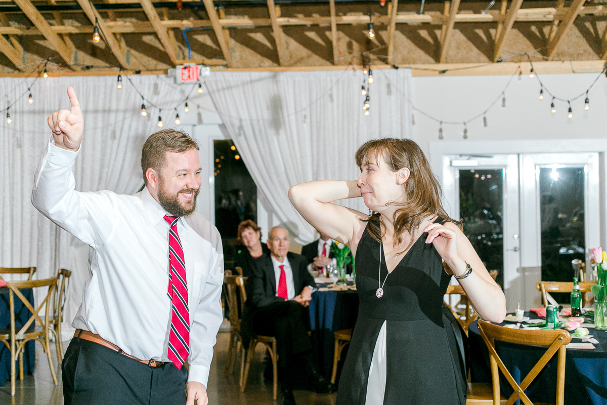 guests dance with each other at reception