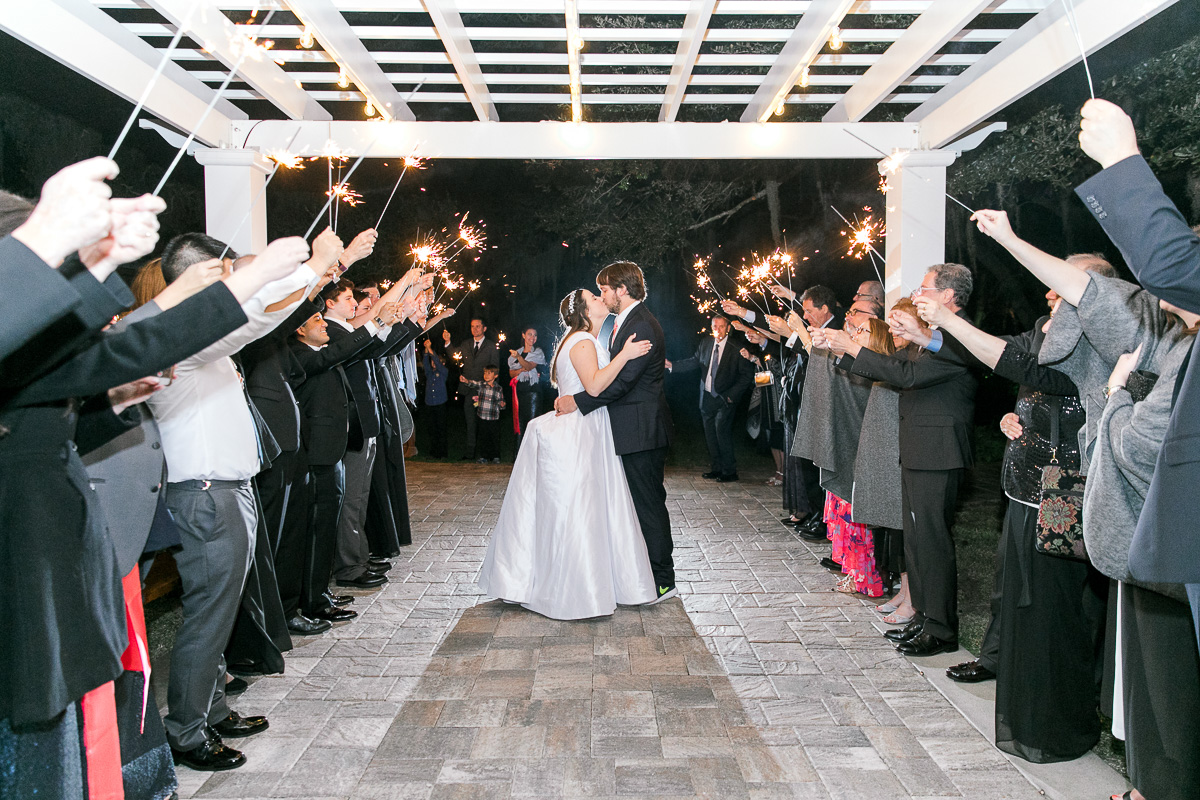 bride and groom kiss at sparkler exit