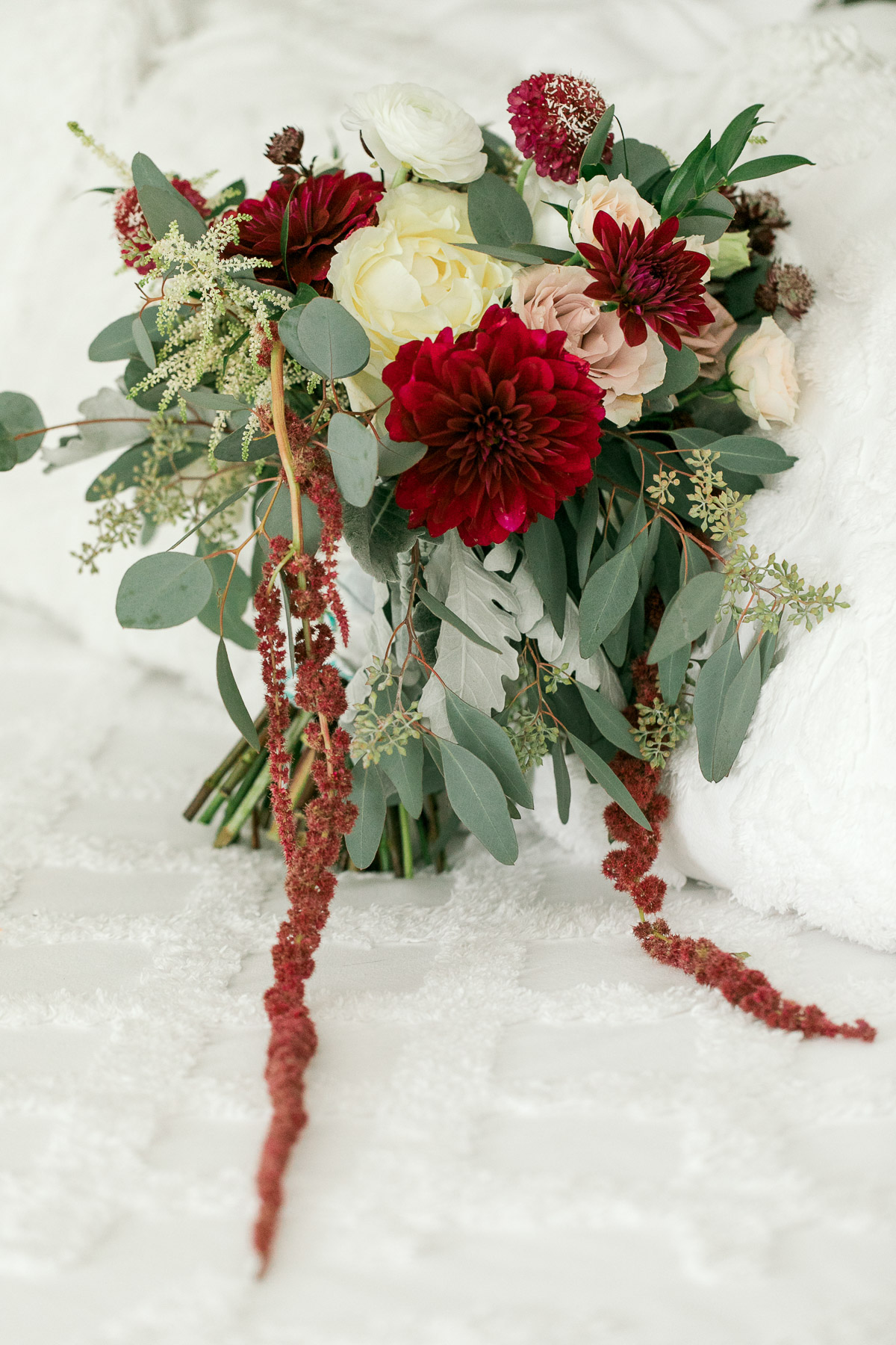 Deep red and light floral bouquet for vintage farm wedding theme