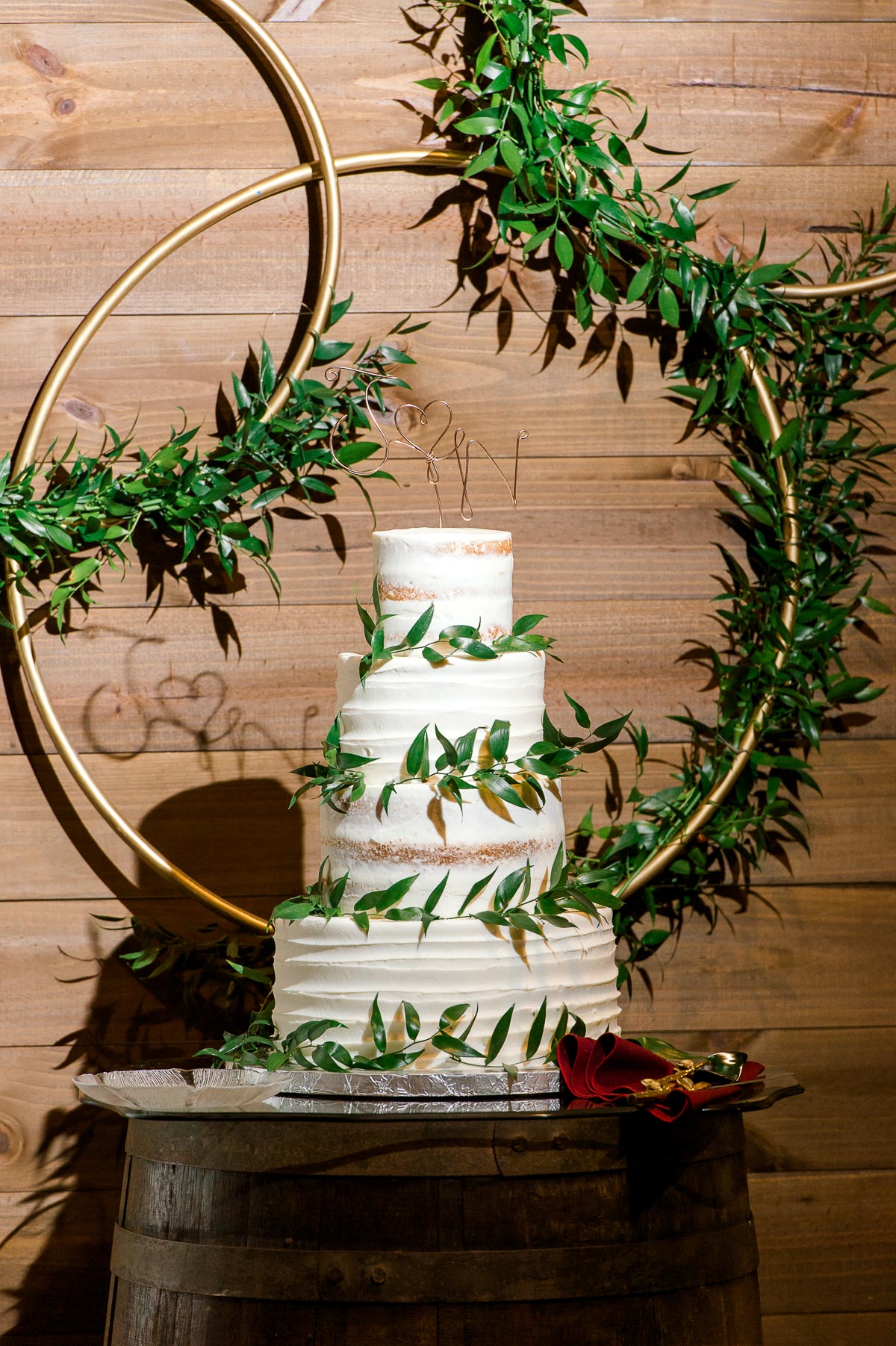 white and green wedding cake with gold accent for vintage farm wedding 