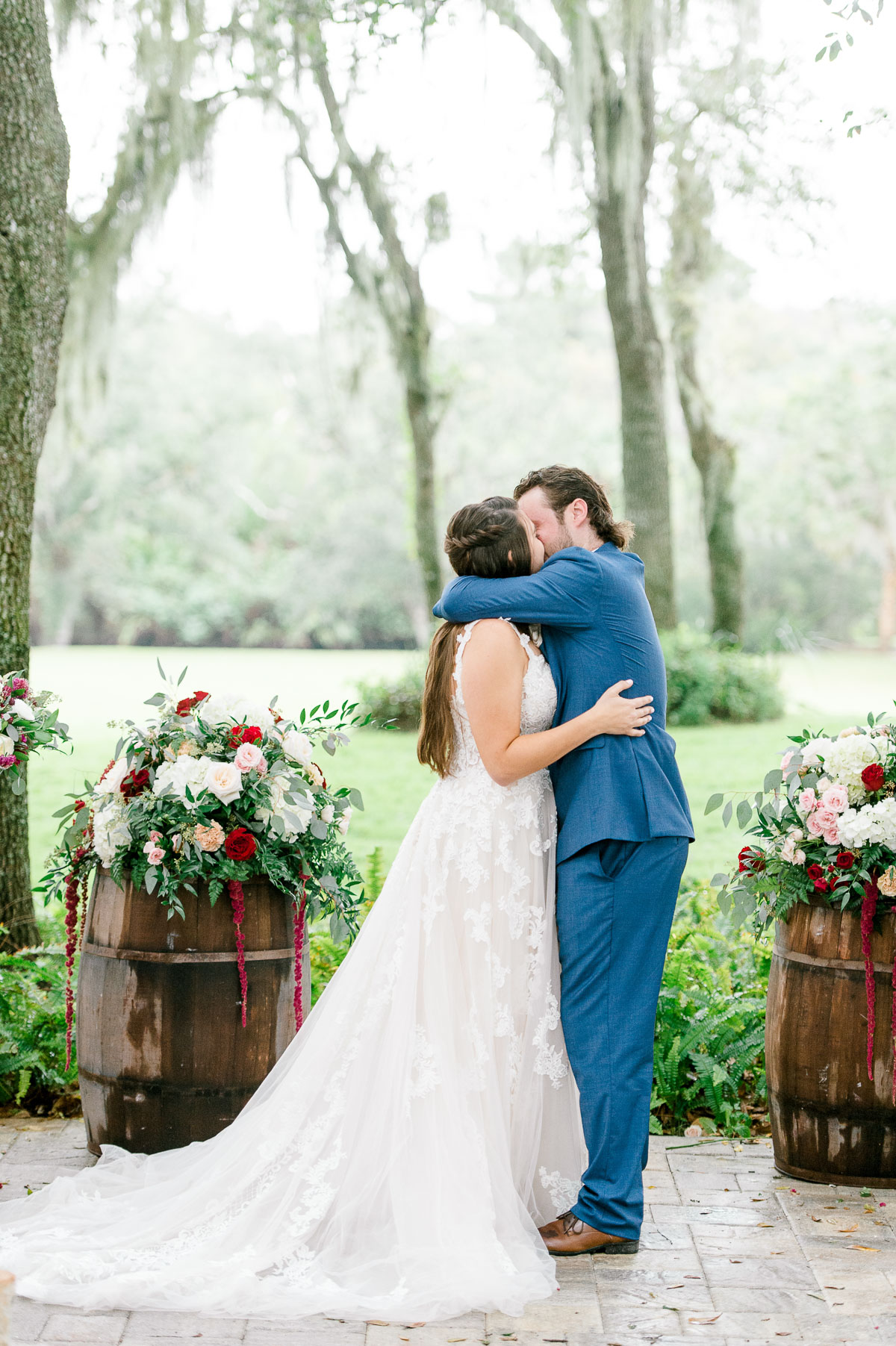Bride and groom's first kiss at wedding ceremony