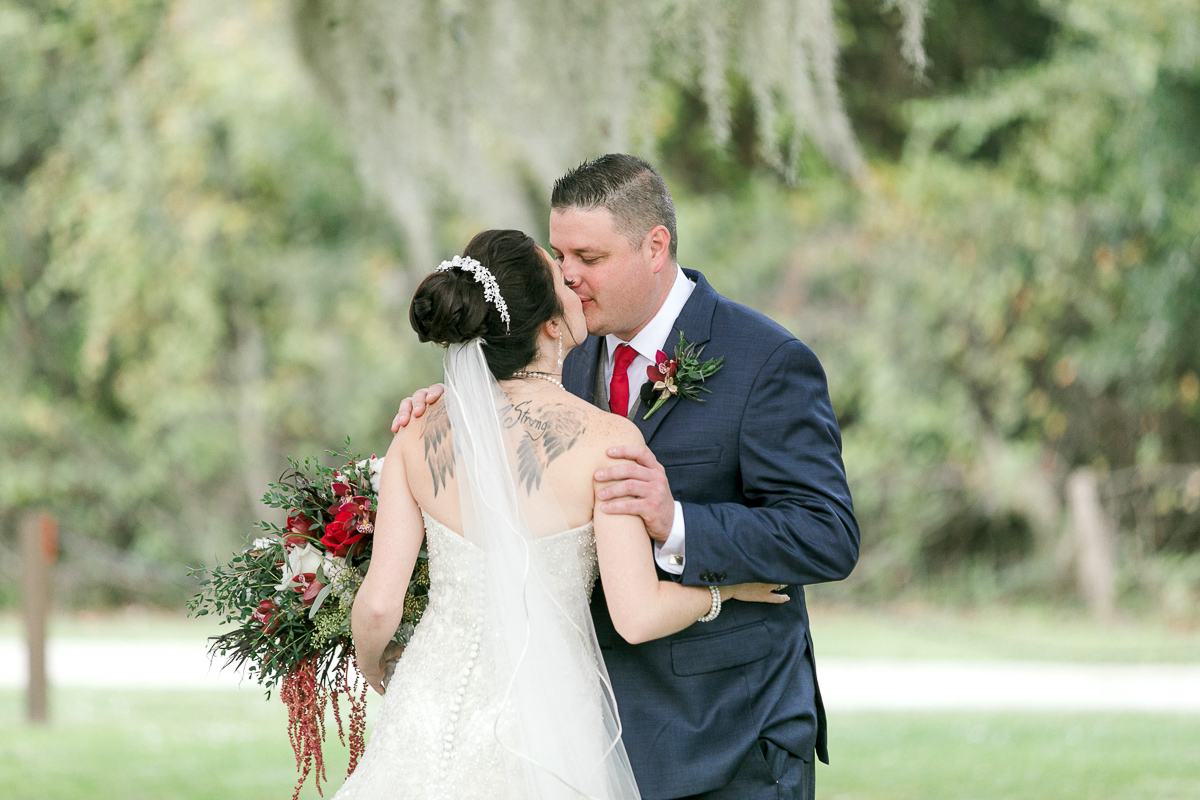 Bride and groom kiss after seeing each other at first look 