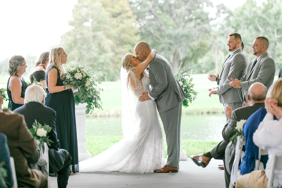 Bride and groom kiss for the first time as husband and wife
