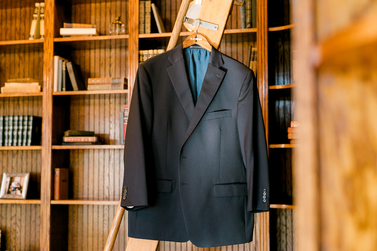 Grooms jacket hanging in the library at Luxmore Grande Estate 