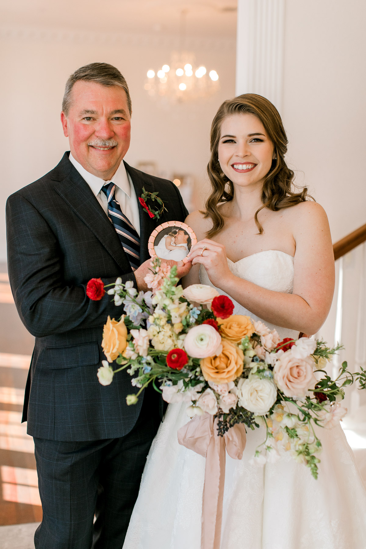 Bride and dad posing with wedding day gift 